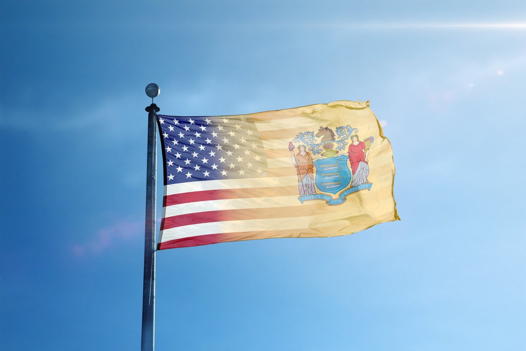 a flag flying in the wind on a sunny day