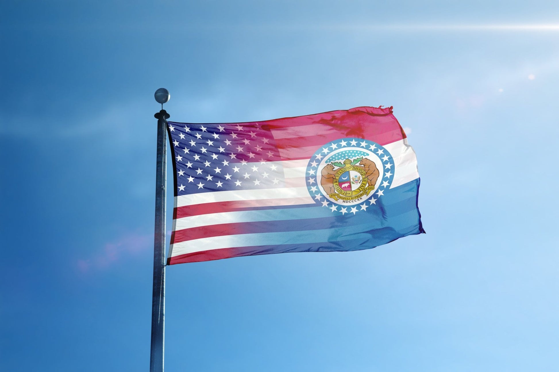 the flag of the state of new york flies high in the blue sky