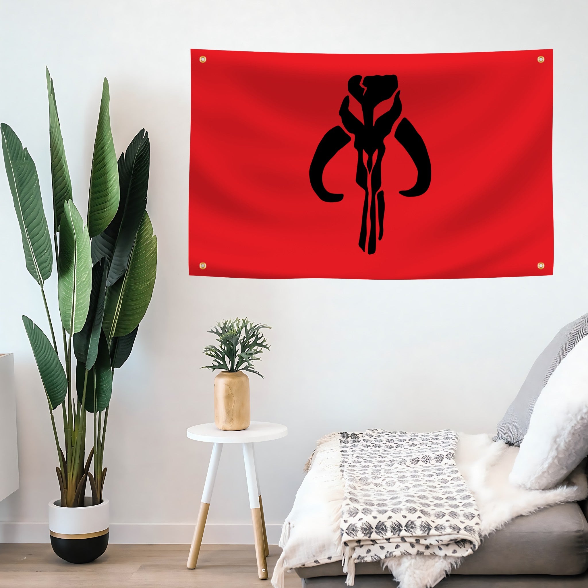 Red flag with a black star wars mandalorian emblem hanging on a living room wall