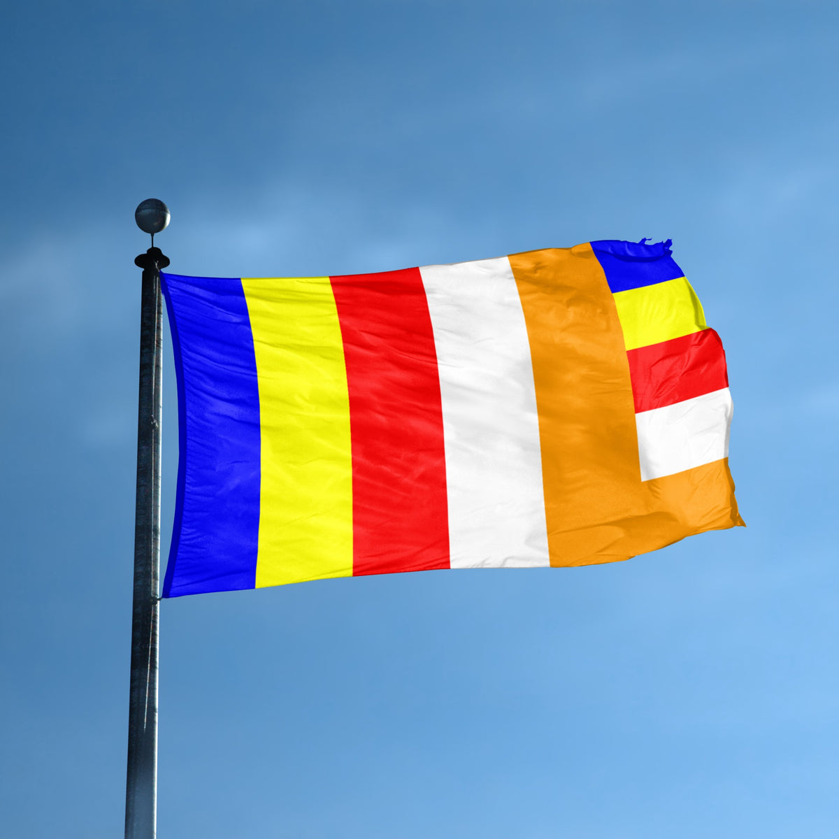 The Buddhism flag with vertical blue, yellow, red, and white stripes flying on a flagpole. 