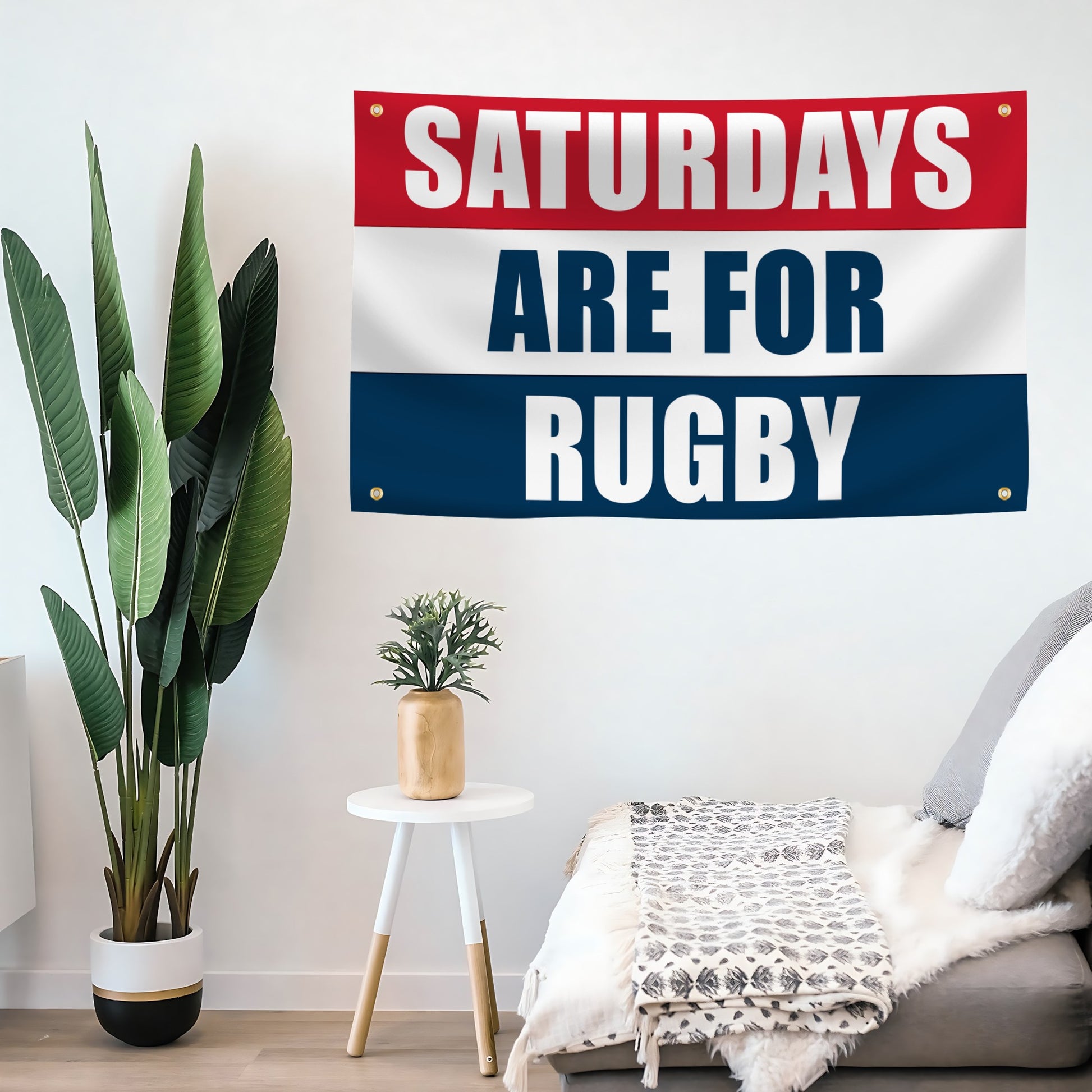 Saturdays are for rugby banner in red, white and blue hanging on a living room wall. 