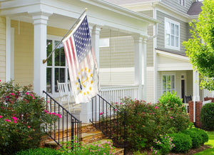 an american flag on a porch of a house