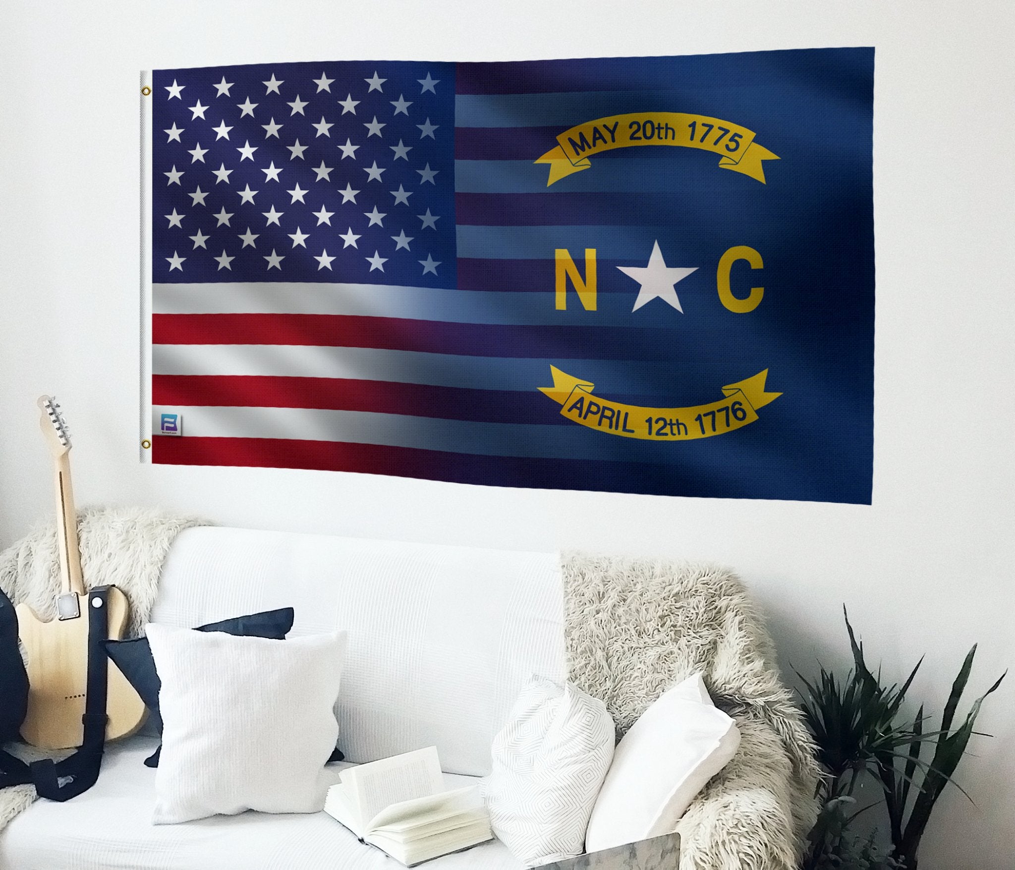 a flag hanging on a wall next to a couch