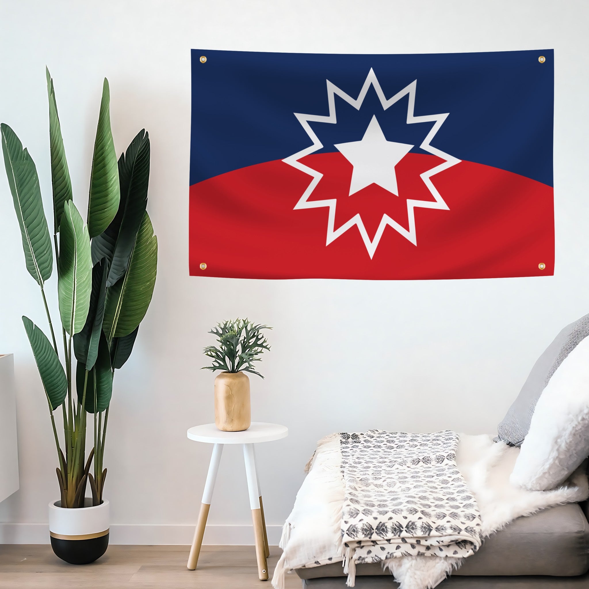 Decorative Juneteenth flag with a star design on a wall in a room with plants and furniture.