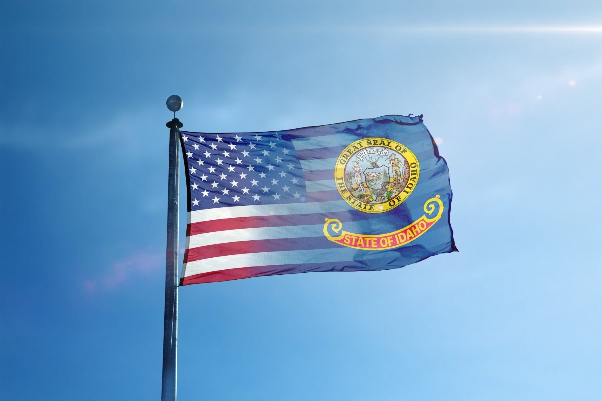 a flag flying in the wind on a sunny day