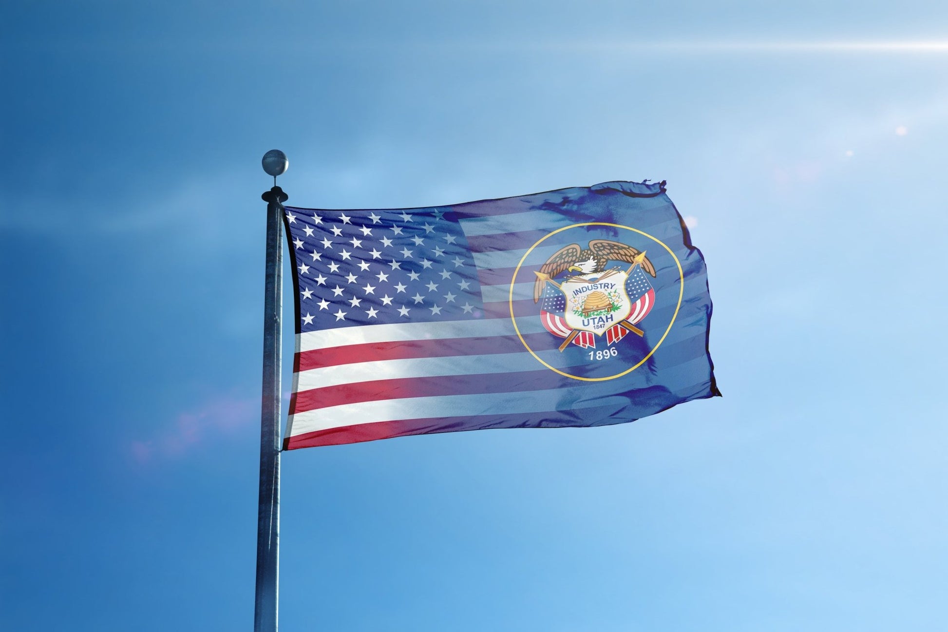 a flag flying in the wind on a sunny day