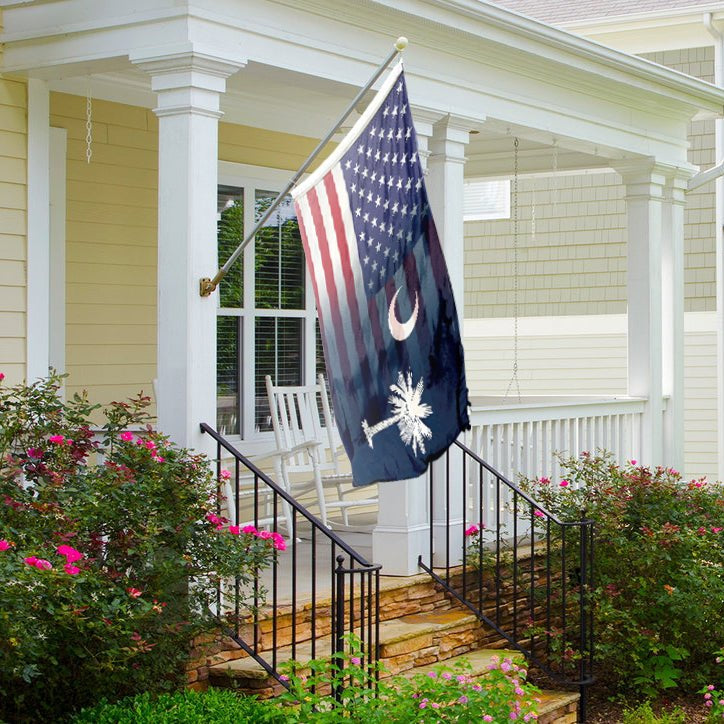Flag with American and South Carolina designs blended together on a front porch.