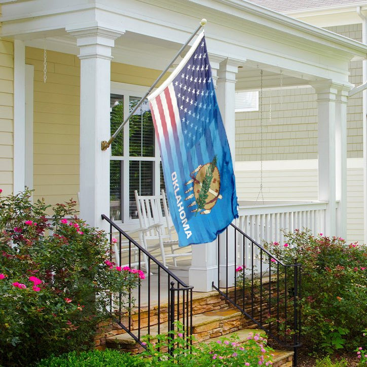 Flag of Oklahoma with American flag design blended together on a front porch. 