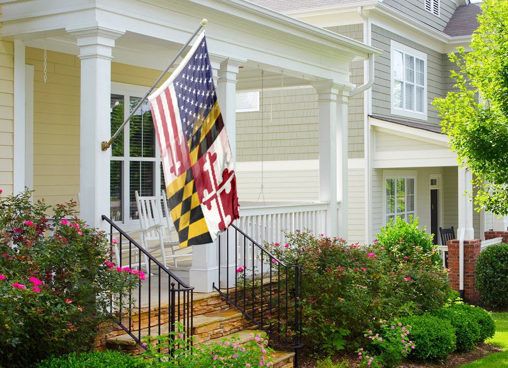 a flag on a porch next to a house