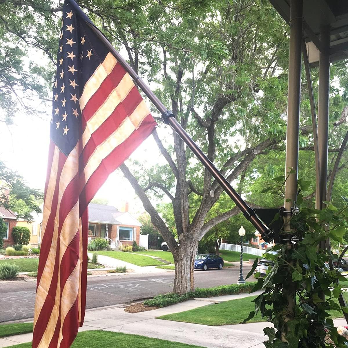 American flag displayed on porch using railing mount clamp bracket at 45-degree angle for outdoor flag display
