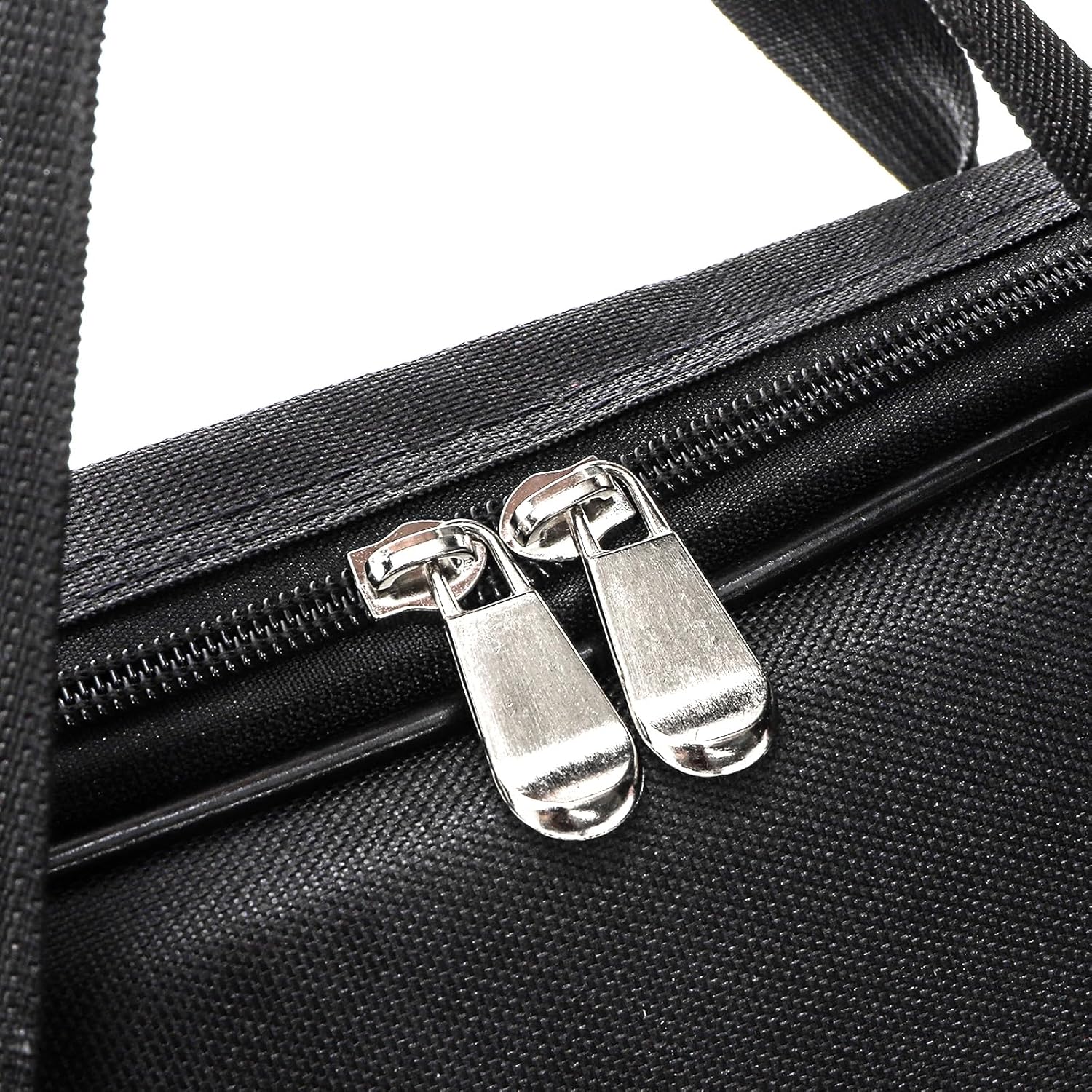 Close-up of a black feather flag bag with silver zippers on a white background