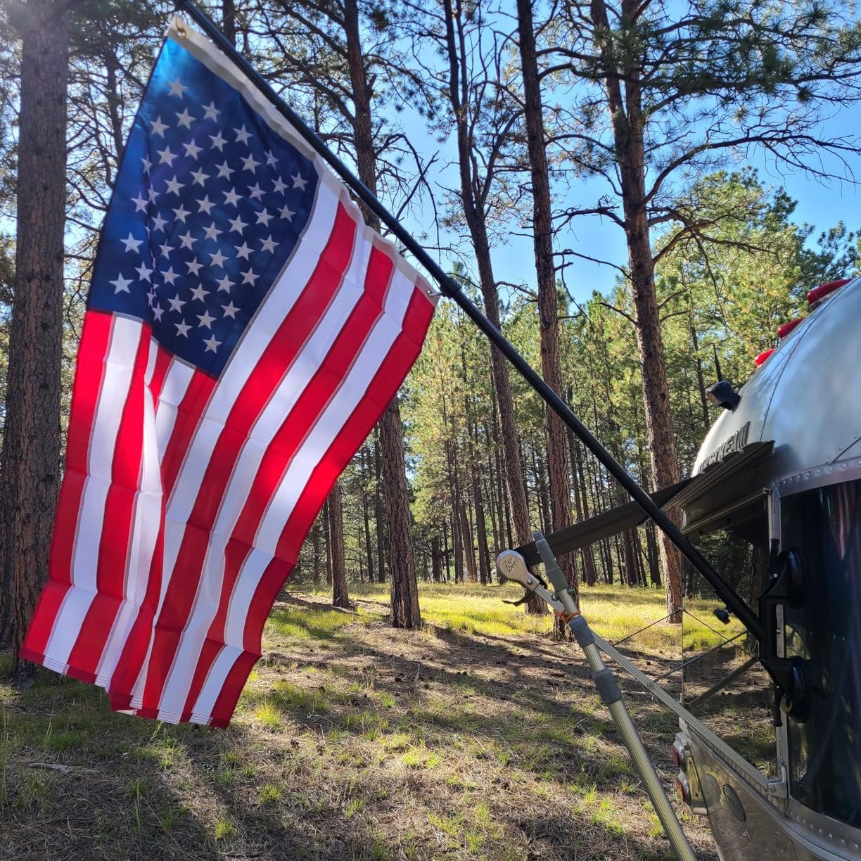 American flag displayed on RV using suction cup mount bracket demonstrating secure outdoor flag display while traveling