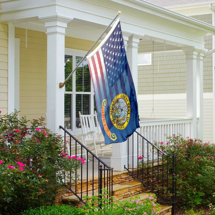 the state of idaho flag blended with the stars and stripes of the american flag hanging on a porch