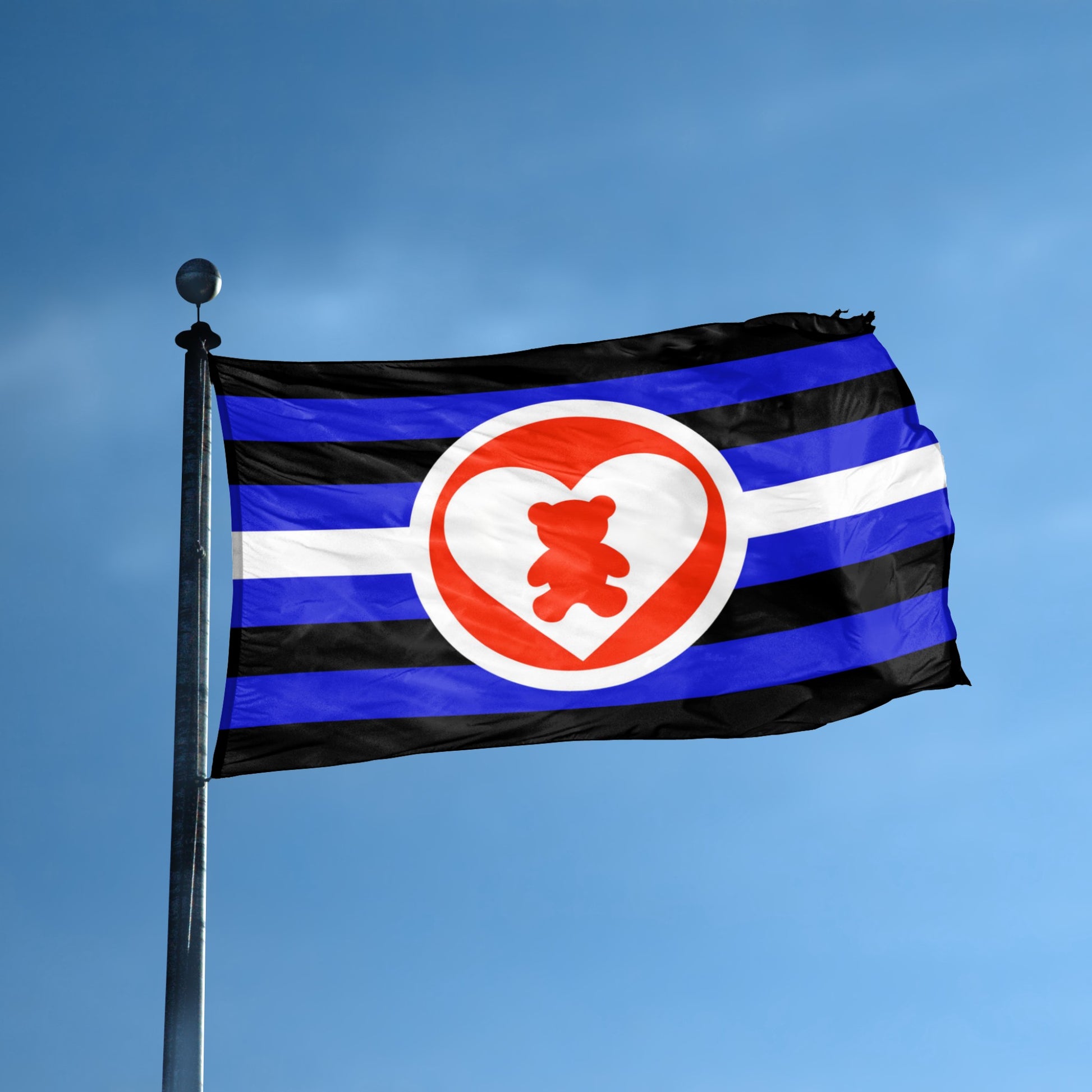 DDLG Flag with blue, black, and white stripes and a red heart with a bear inside on a flag pole