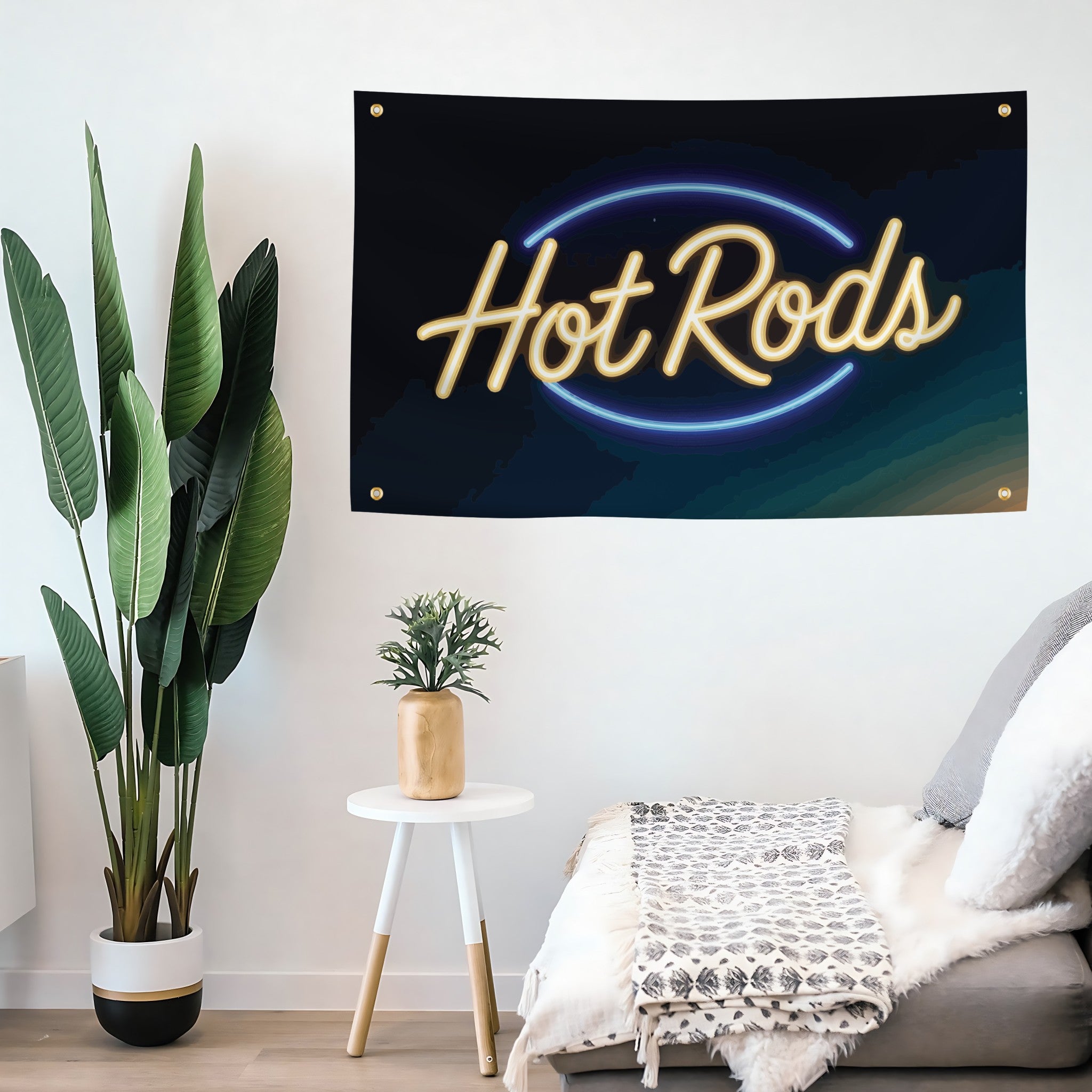 Neon-style 'Hot Rods' banner hanging on a wall above a sofa with decorative plants.