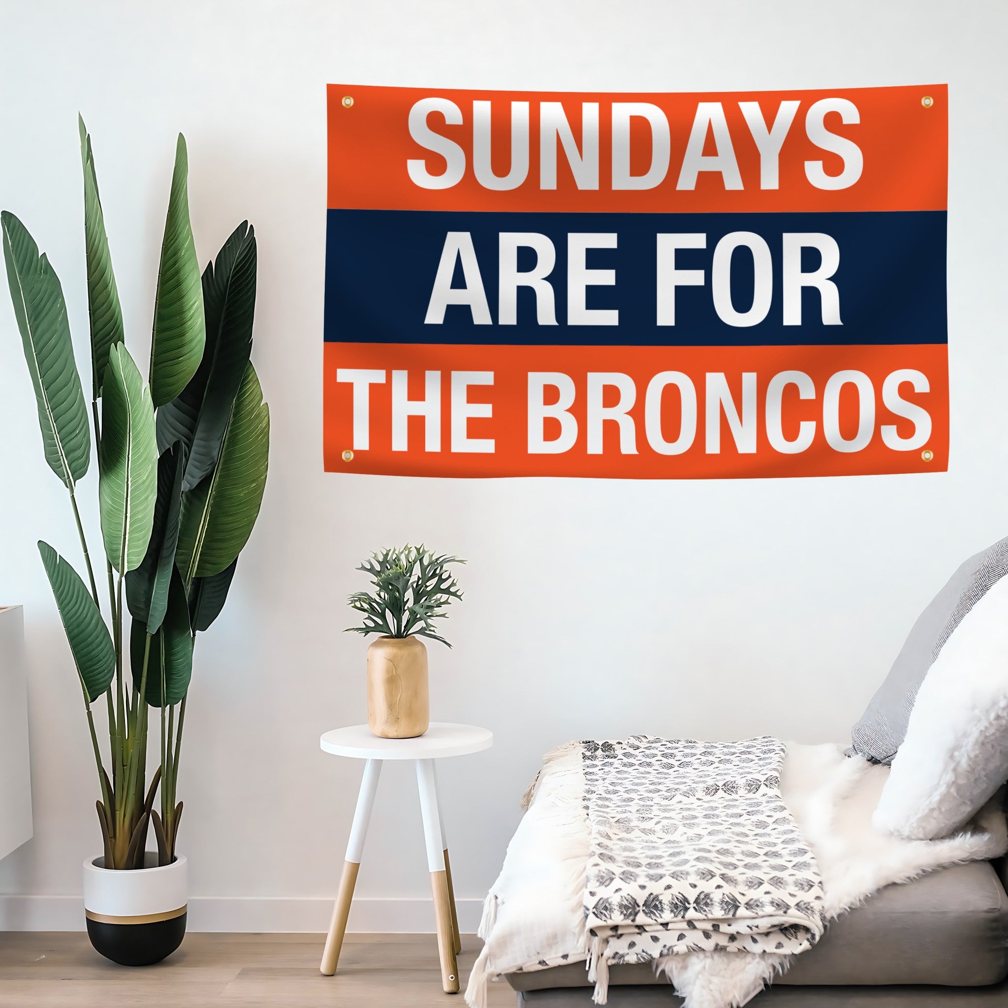 Decorative flag banner with 'Sundays are for the Broncos' text in a living room setting.