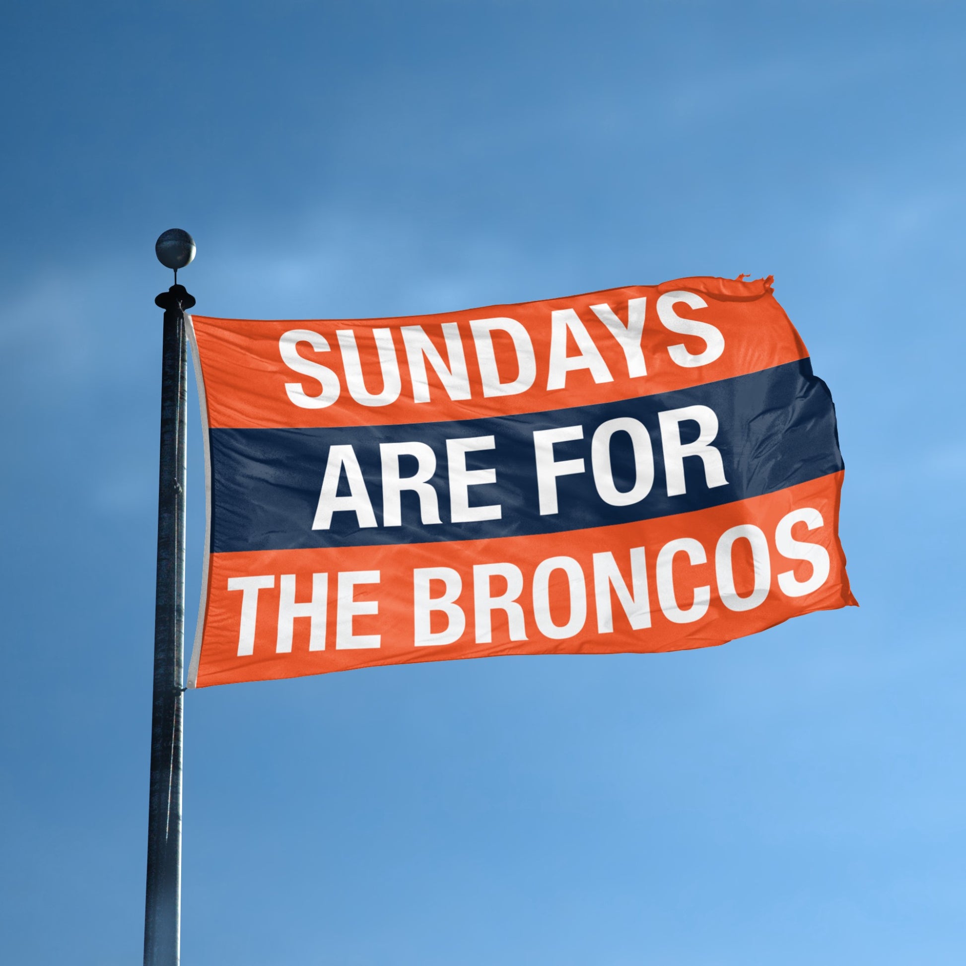 Flag with 'Sundays are for the Broncos' text against a blue sky