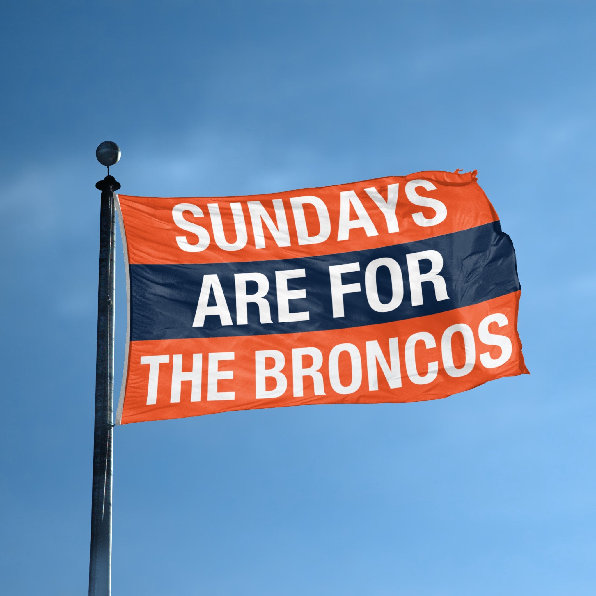 Flag with 'Sundays are for the Broncos' text against a blue sky