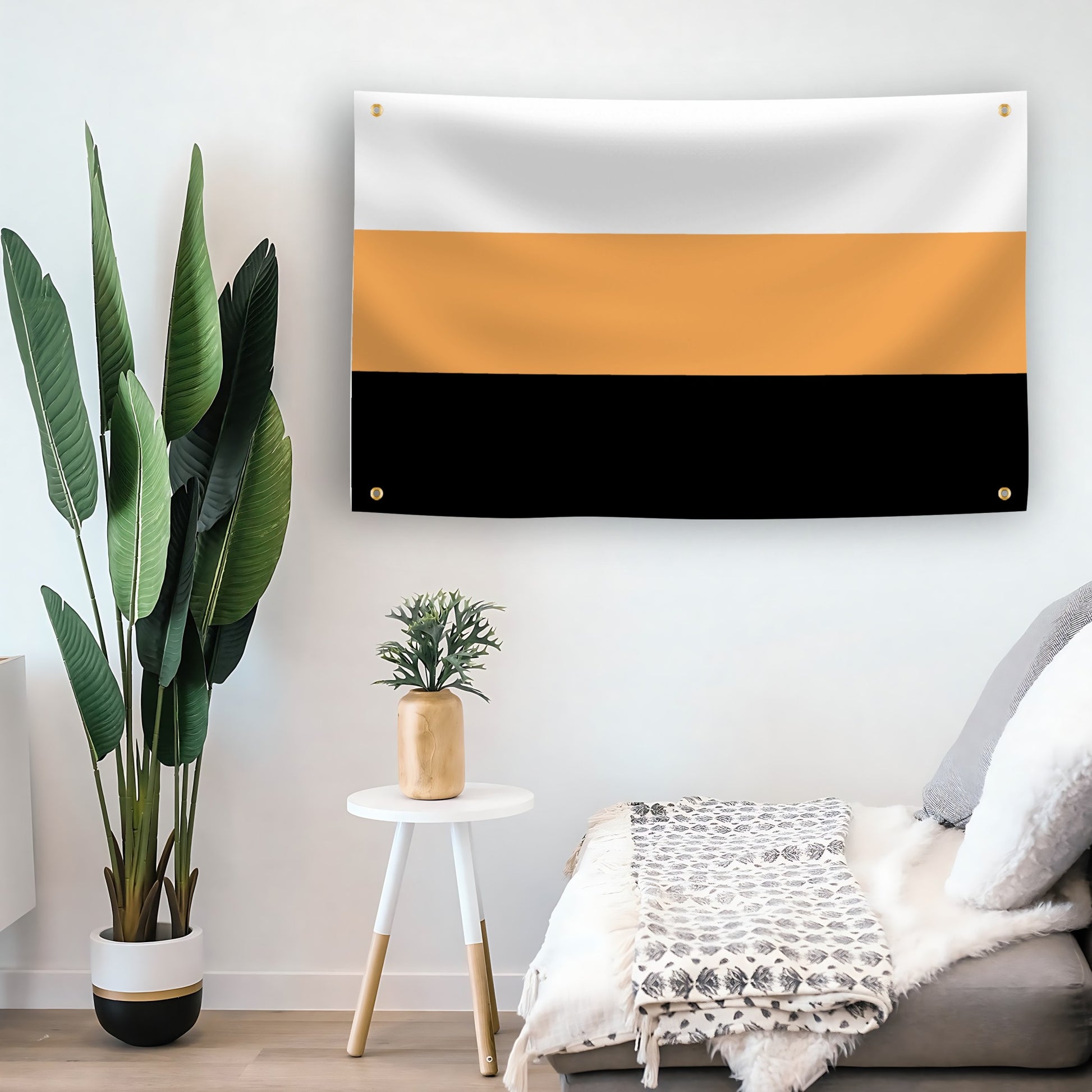 System Pride Flag with horizontal white, orange, and black stripes and 4 grommets in a room by Bannerfi