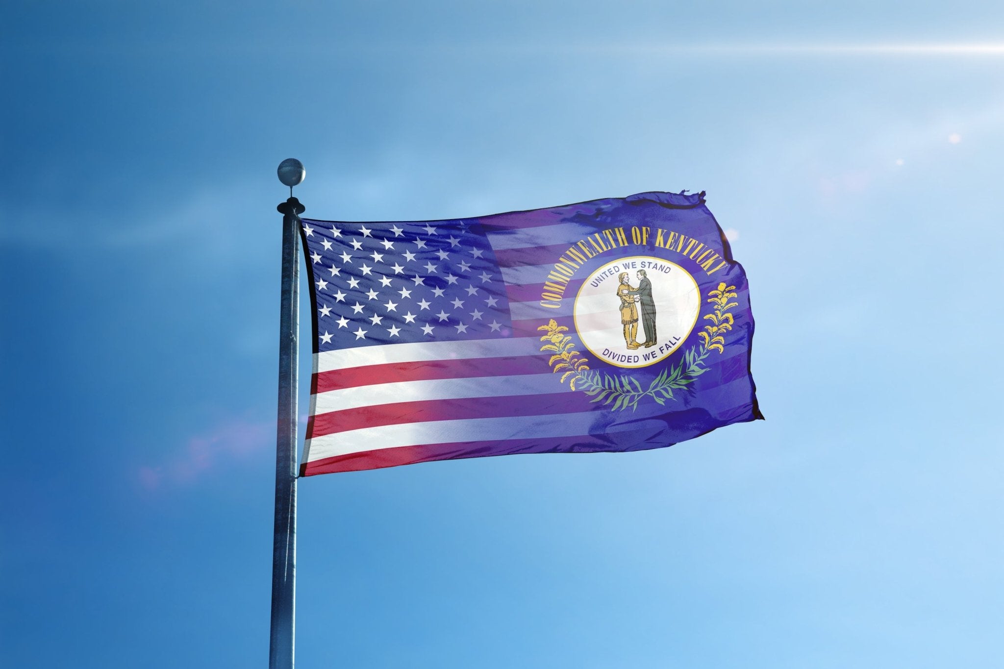 a flag flying in the wind with a blue sky in the background