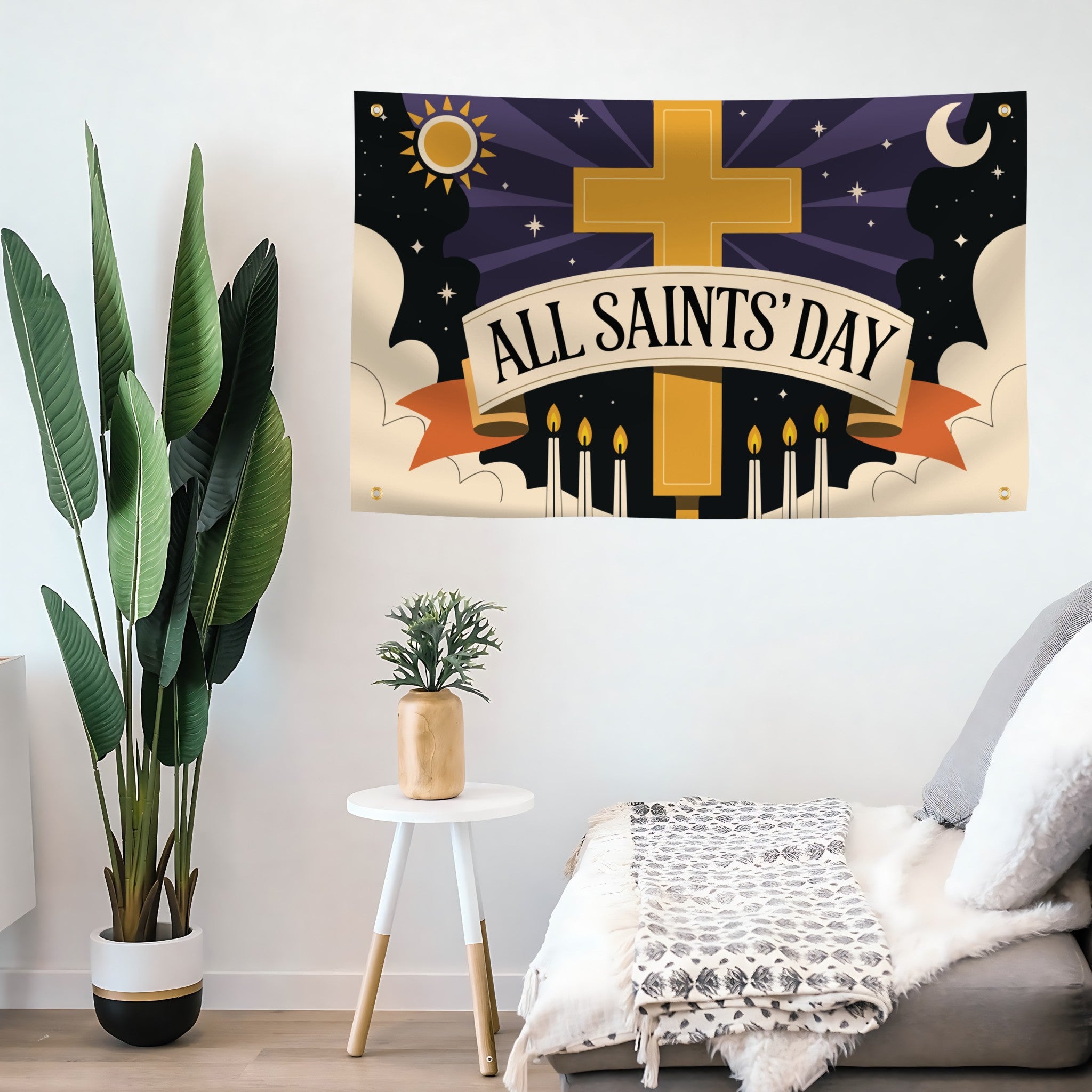 Decorative flag banner for All Saints' Day with a cross and candles on a wall.