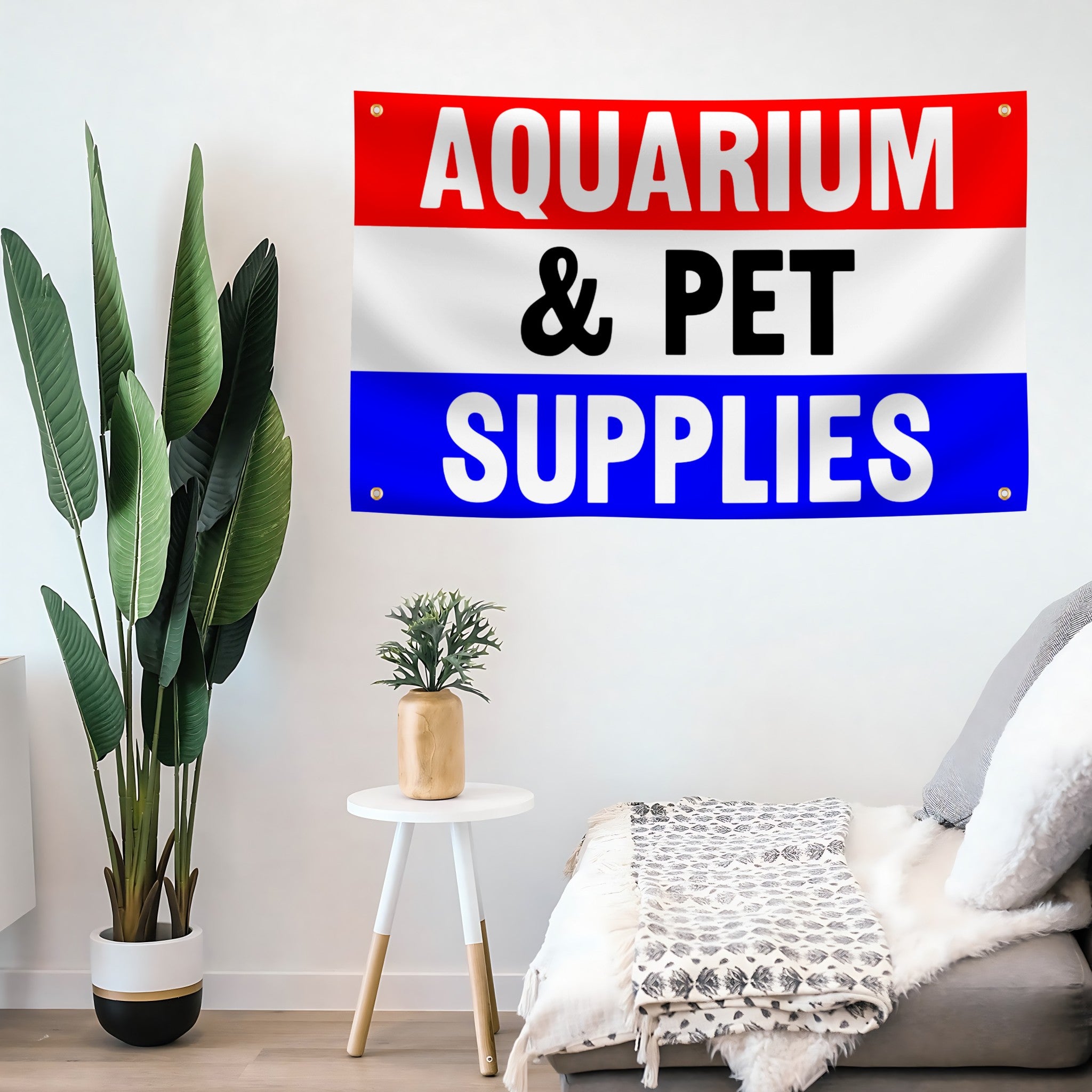 A banner with horizontal red, white, and blue stripes, featuring the text 'AQUARIUM & PET SUPPLIES' in bold letters mounted on a wall.