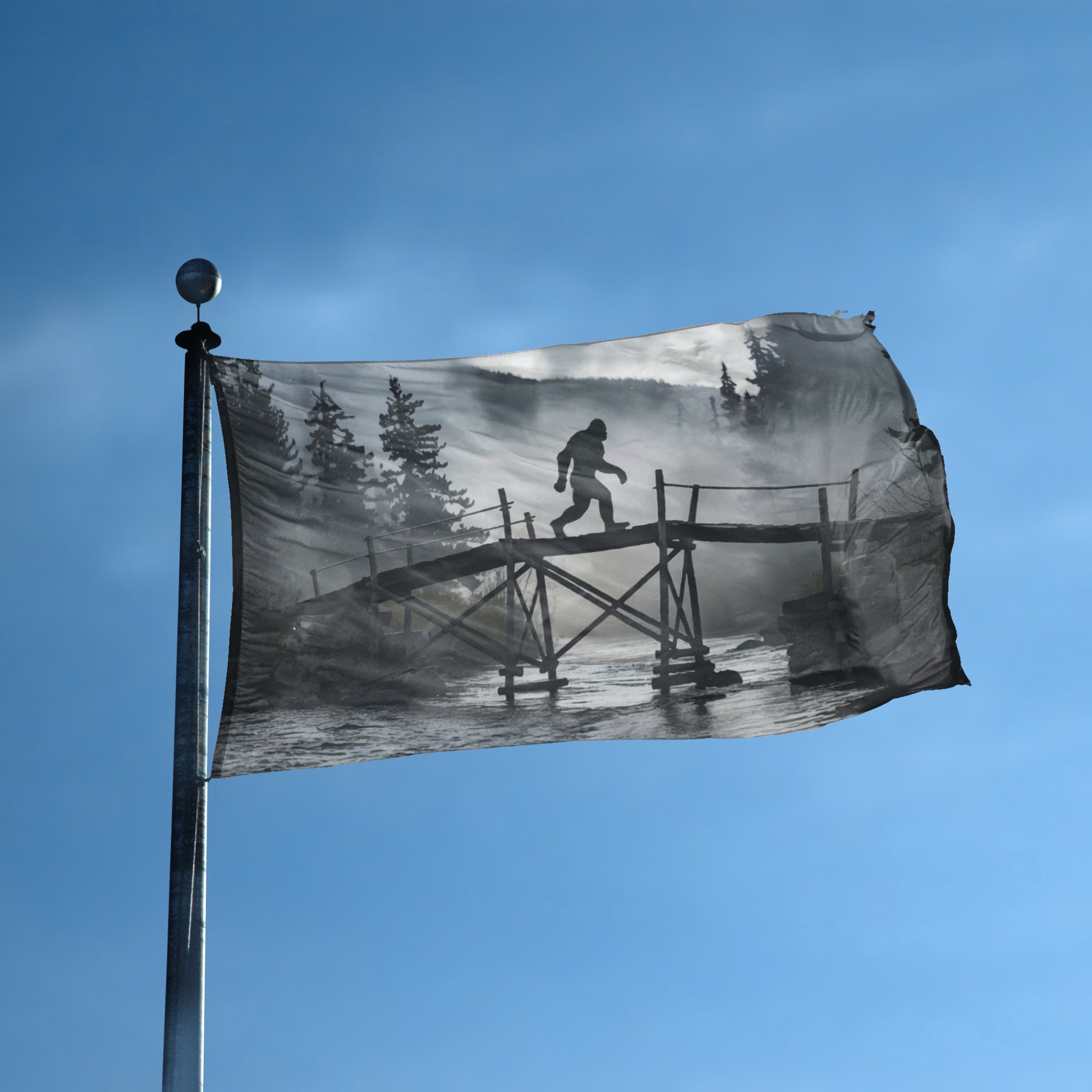 A flag with the theme "Bigfoot Bridge Sighting" displayed on a tall flag pole and blue skies.