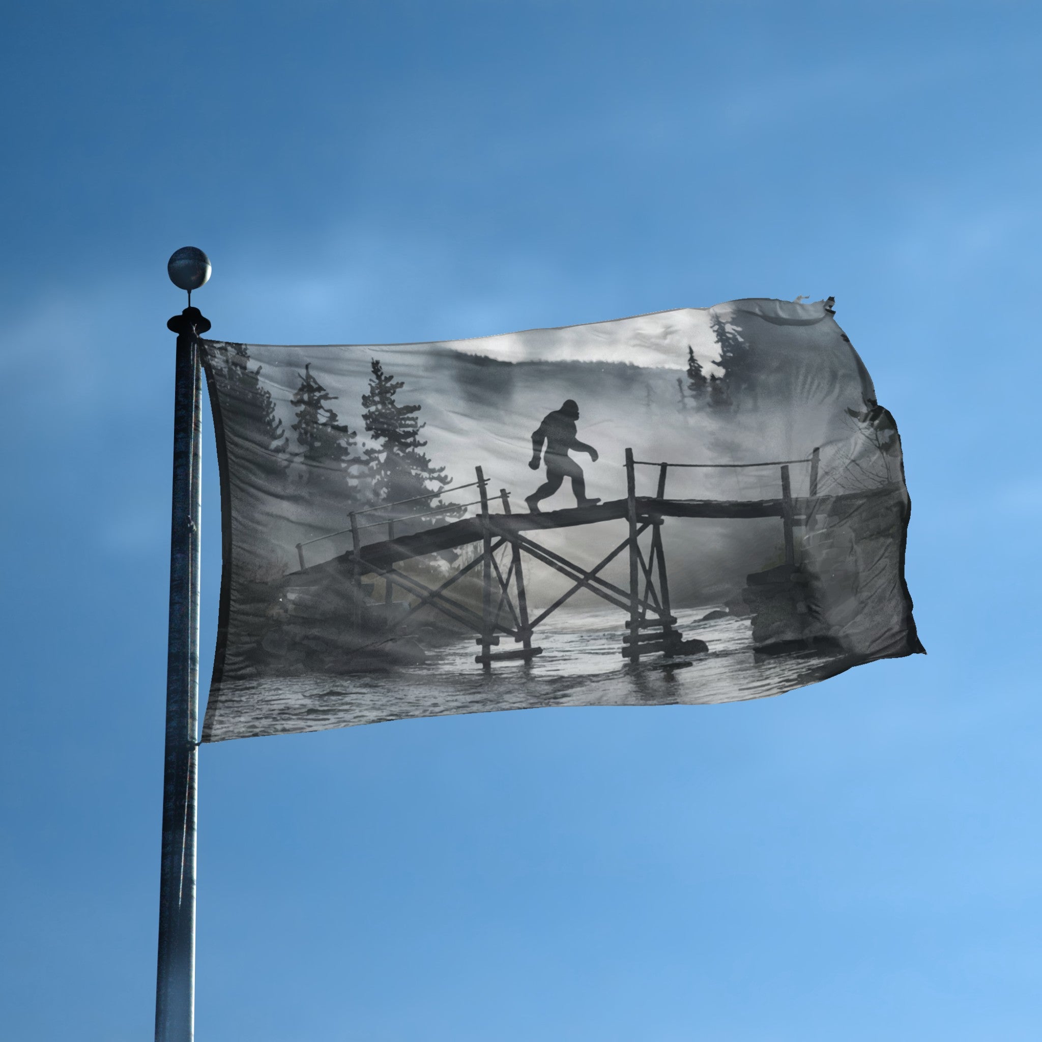 A flag with the theme "Bigfoot Bridge Sighting" displayed on a tall flag pole and blue skies.