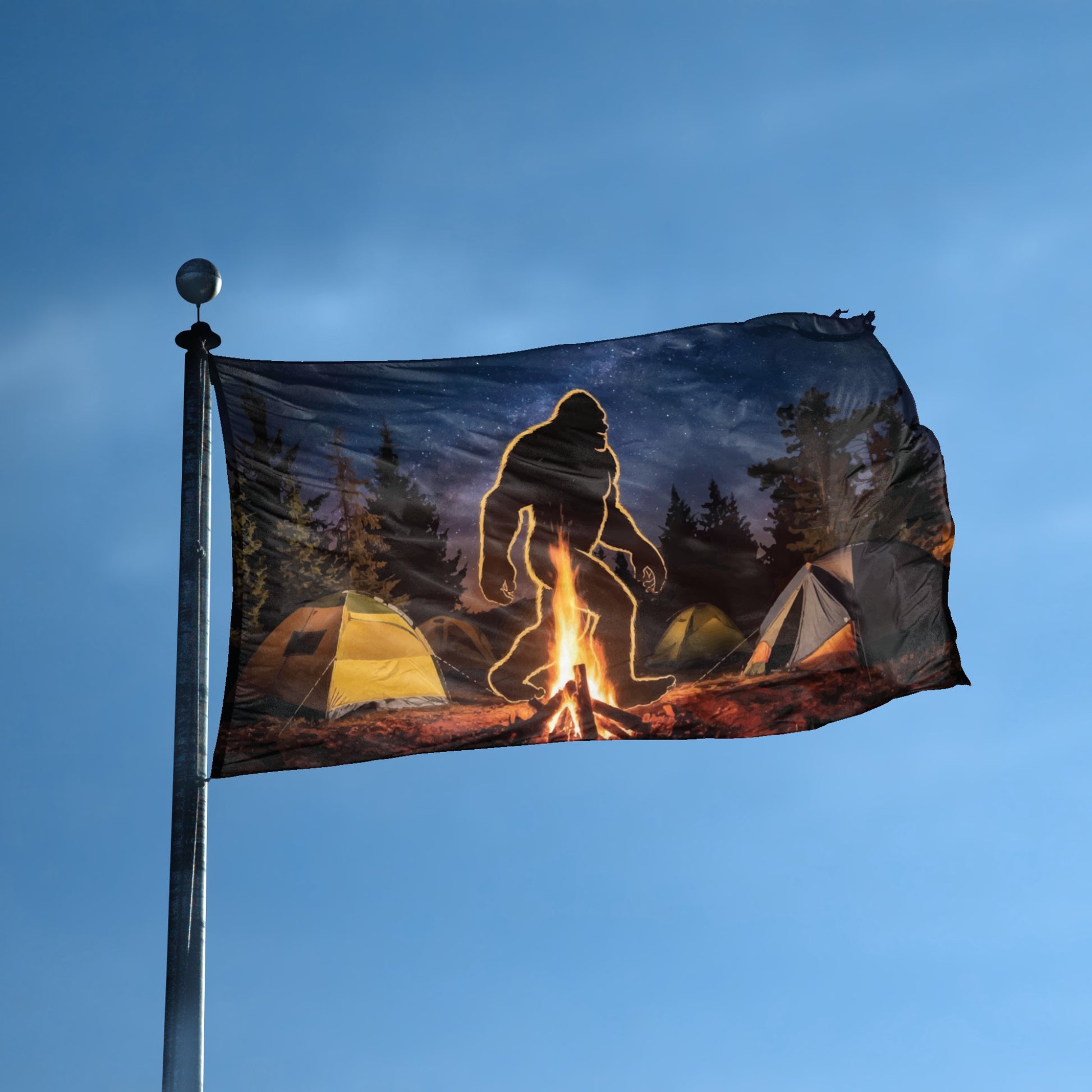 A flag with the theme "Bigfoot Campfire" displayed on a tall flag pole and blue skies.