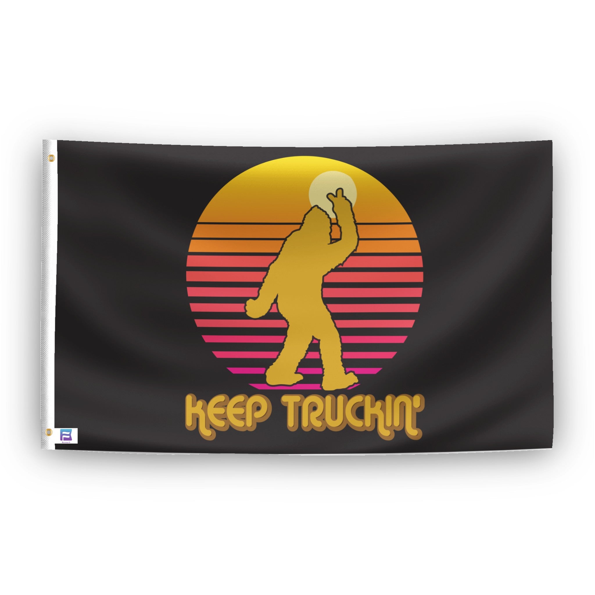 A flag with the theme "Bigfoot Keep Truckin'", displayed with two brass grommets reinforced with a white canvas header.