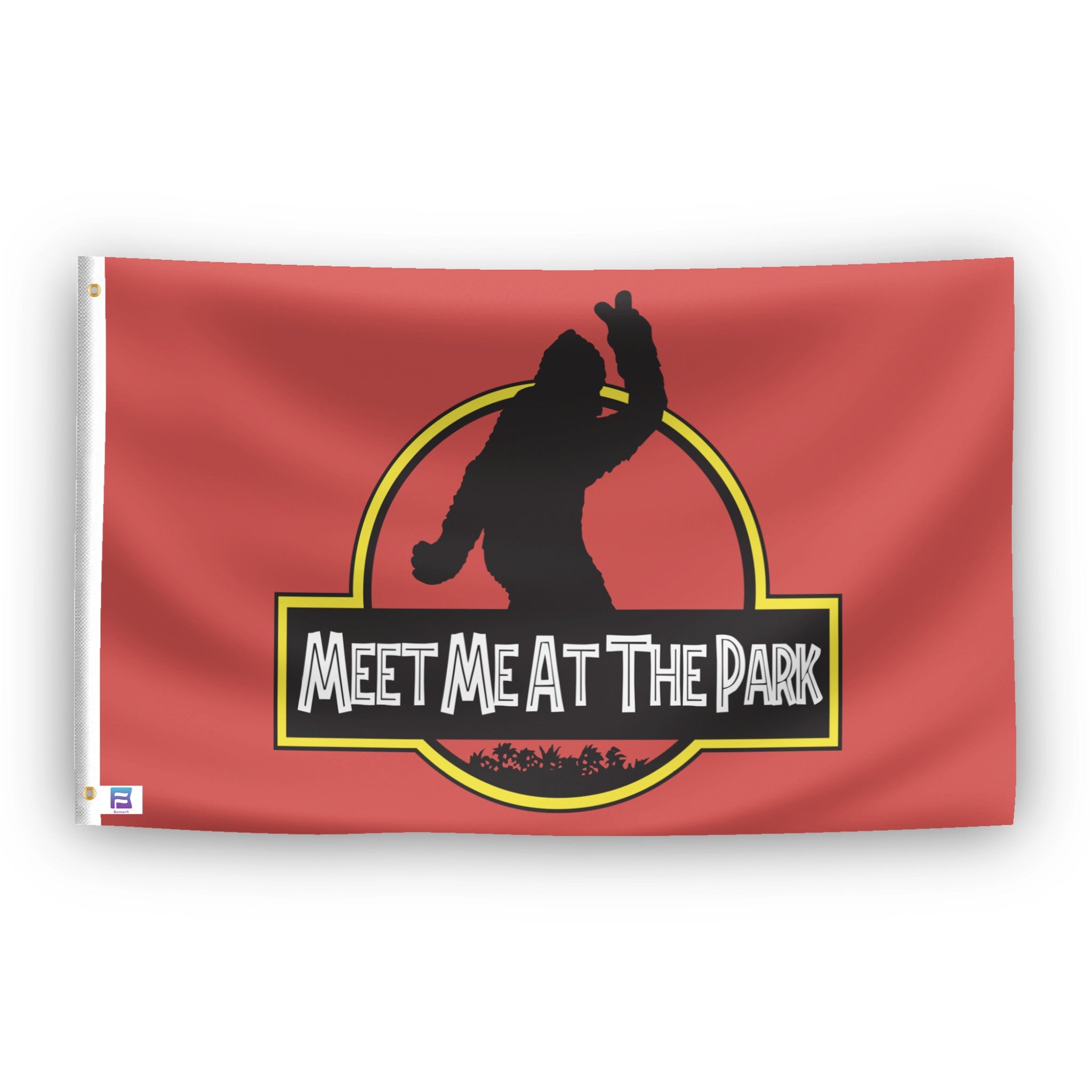 A flag with the theme "Bigfoot Meet Me At The Park Parody", displayed with two brass grommets reinforced with a white canvas header.