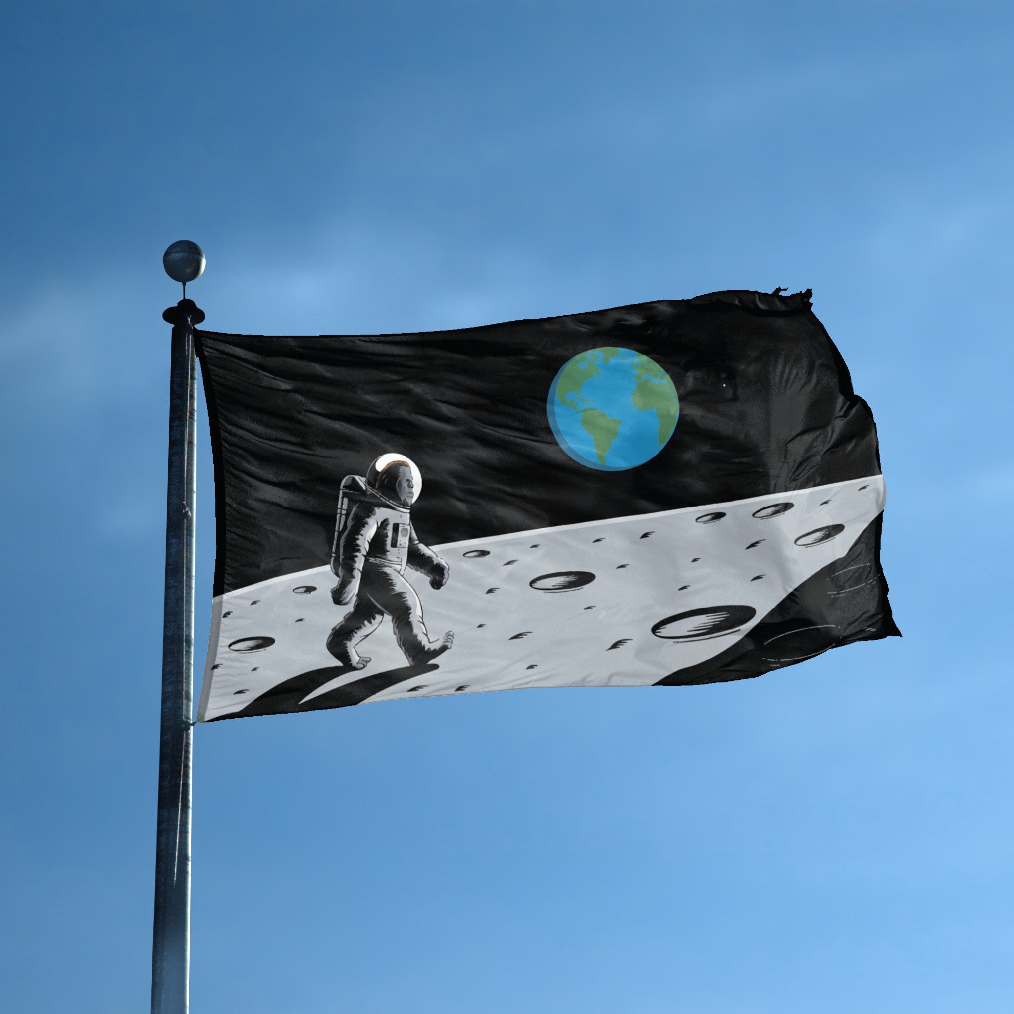 A flag with the theme "Bigfoot Moon Landing" displayed on a tall flag pole and blue skies.