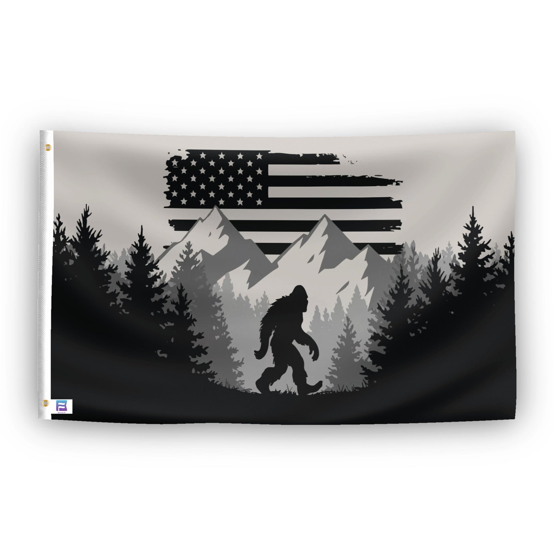 A flag with the theme "Bigfoot Mountains American", displayed with two brass grommets reinforced with a white canvas header.