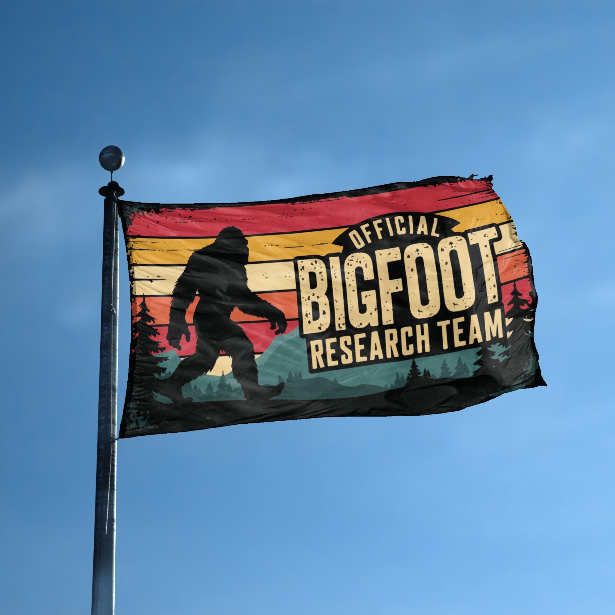 A flag with the theme "Bigfoot Official Research Team" displayed on a tall flag pole and blue skies.