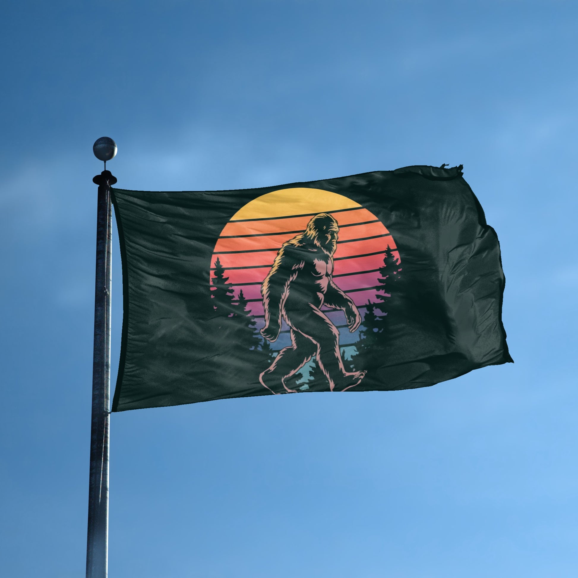 A flag with the theme "Bigfoot Retro Sunset" displayed on a tall flag pole and blue skies.