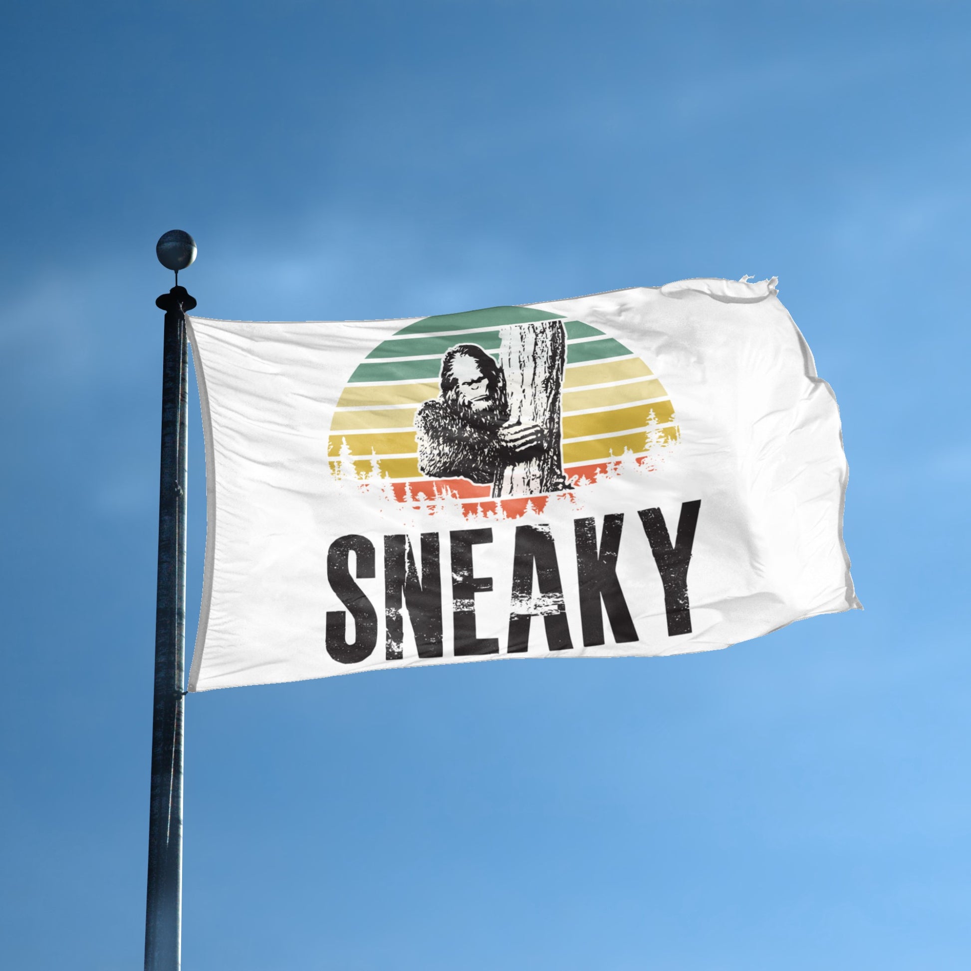 A flag with the theme "Bigfoot Sneaky" displayed on a tall flag pole and blue skies.