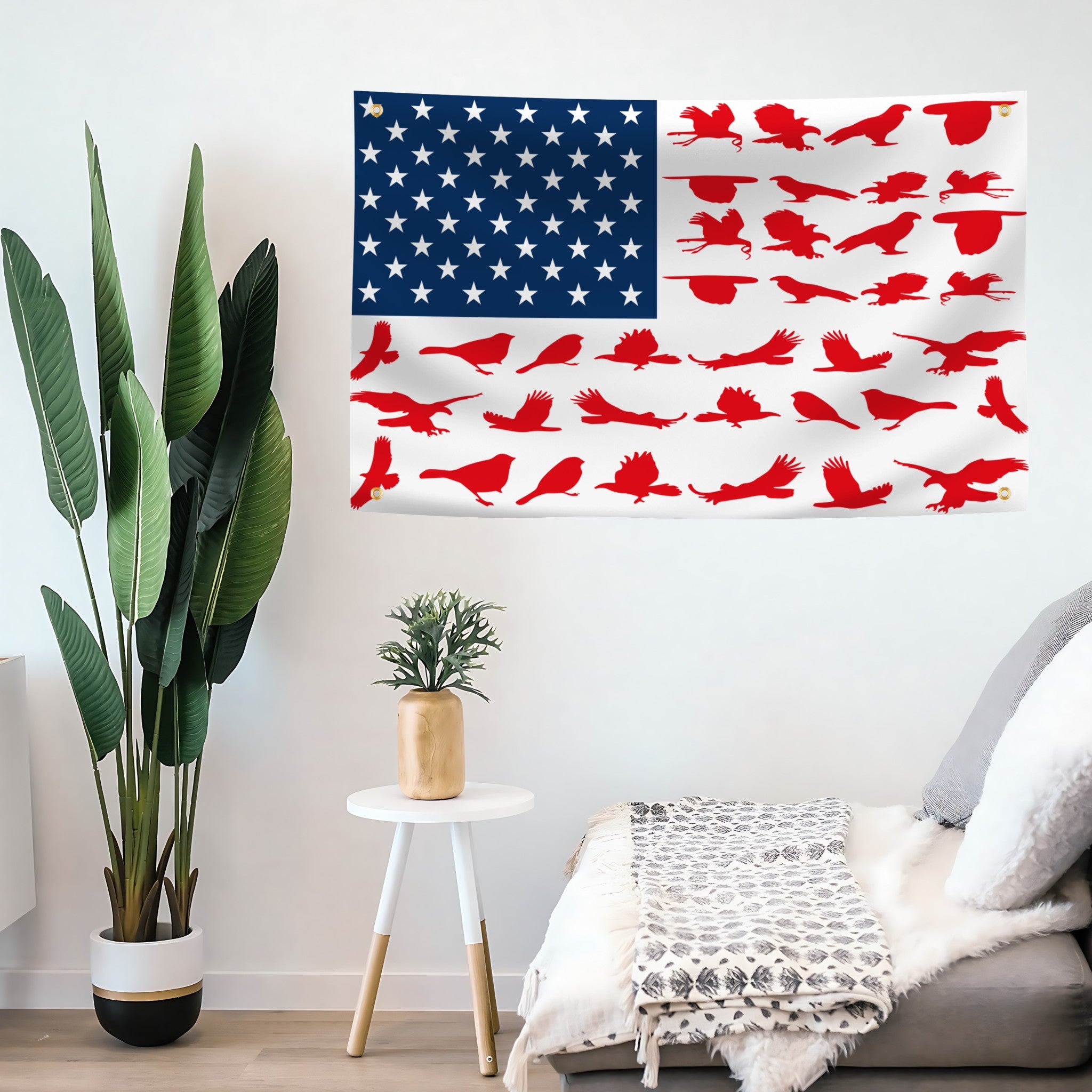 American flag with red bird design on a wall in a living room.