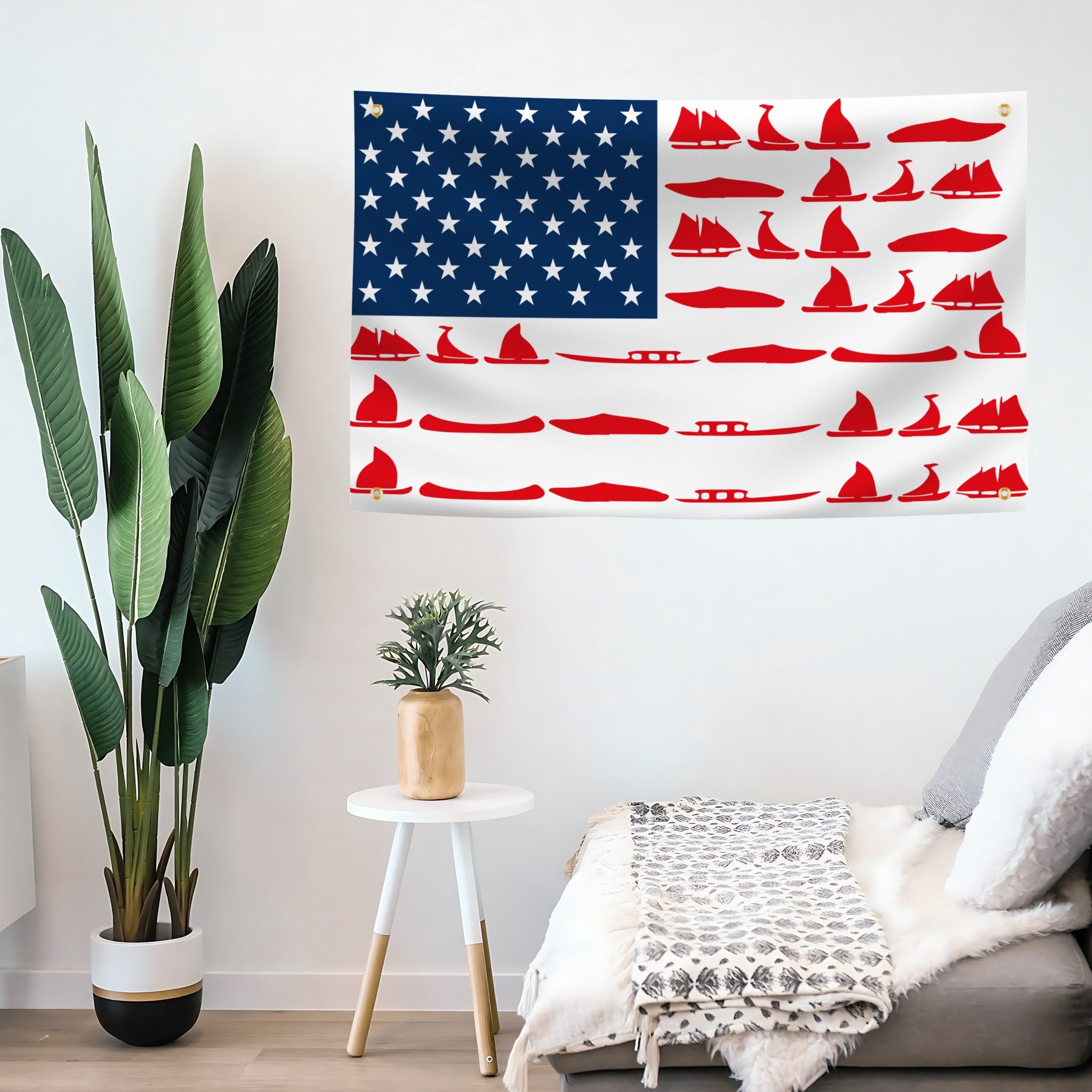 A flag hanging on a living room wall with a stars and stripes pattern, featuring red stripes and white stars, with additional red boats of various designs included in the design.