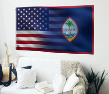 Load image into Gallery viewer, a flag hanging on a wall next to a couch
