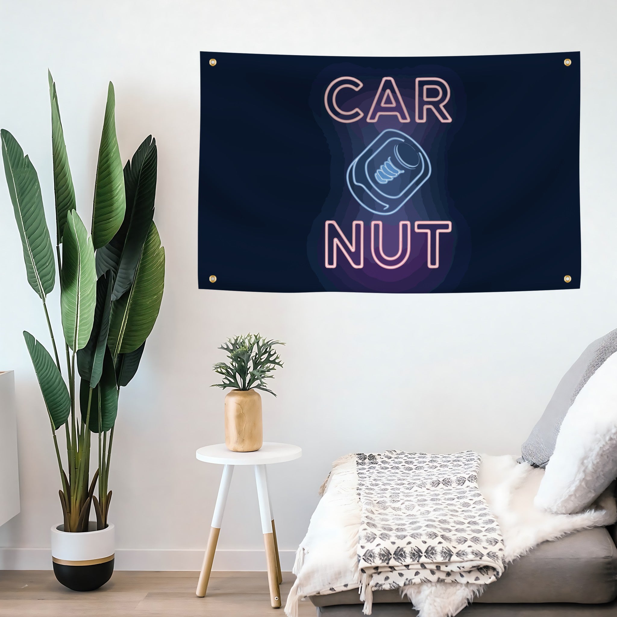 Neon sign-style flag banner with 'CAR NUT' text in a modern living room.