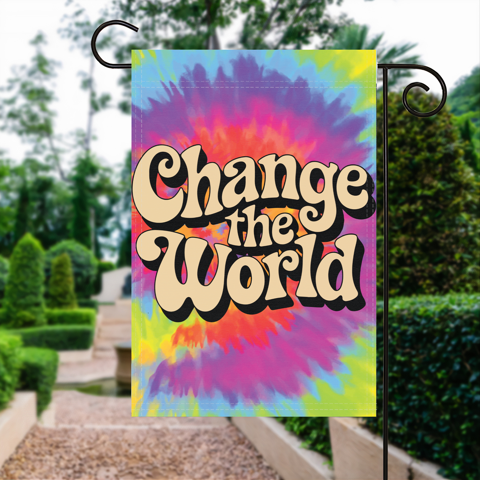 Change The World garden flag made of weatherproof polyester displayed in a garden | Bannerfi