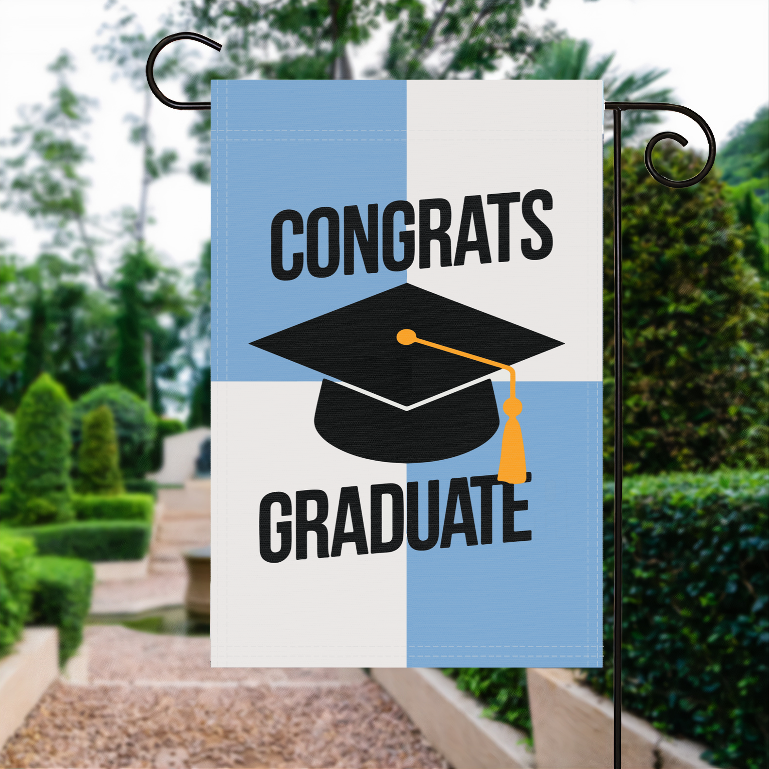 Congrats Graduate garden flag made of weatherproof polyester displayed in a garden | Bannerfi