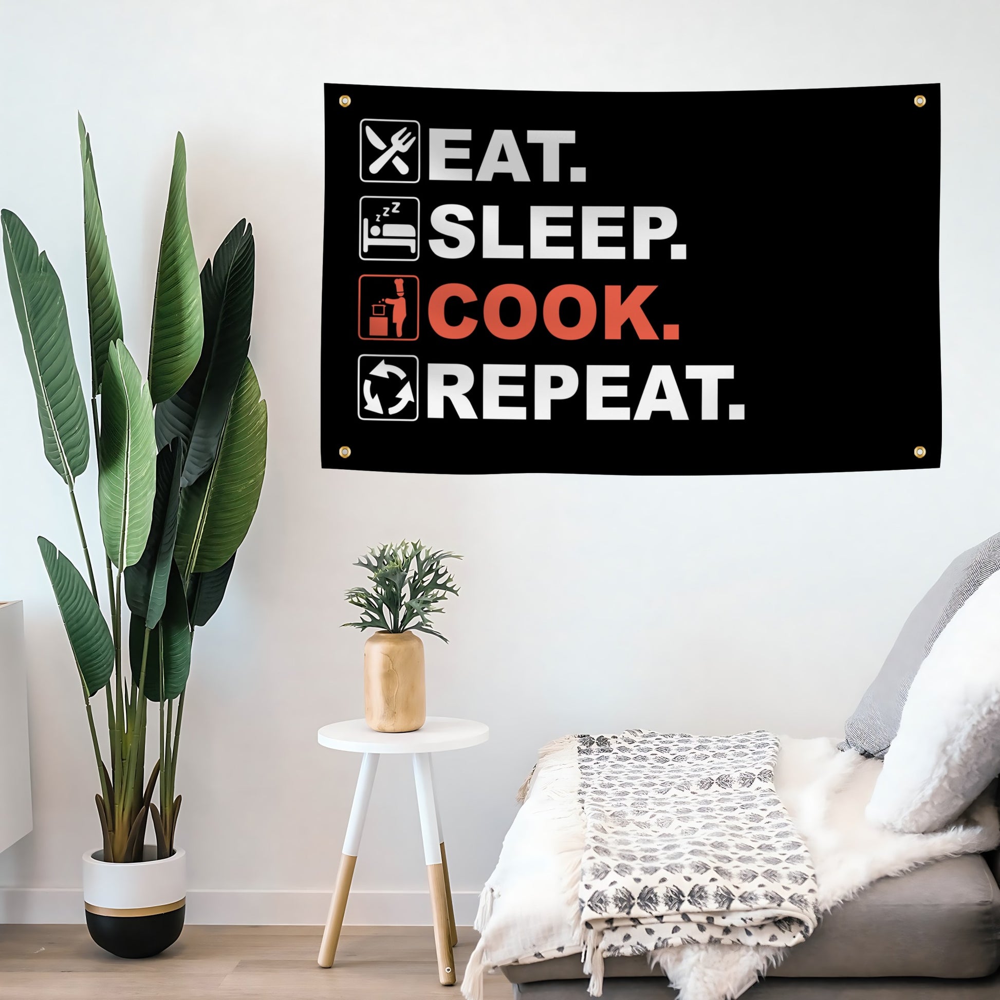 Decorative flag banner with 'Eat. Sleep. COOK. Repeat.' text in a living room setting.
