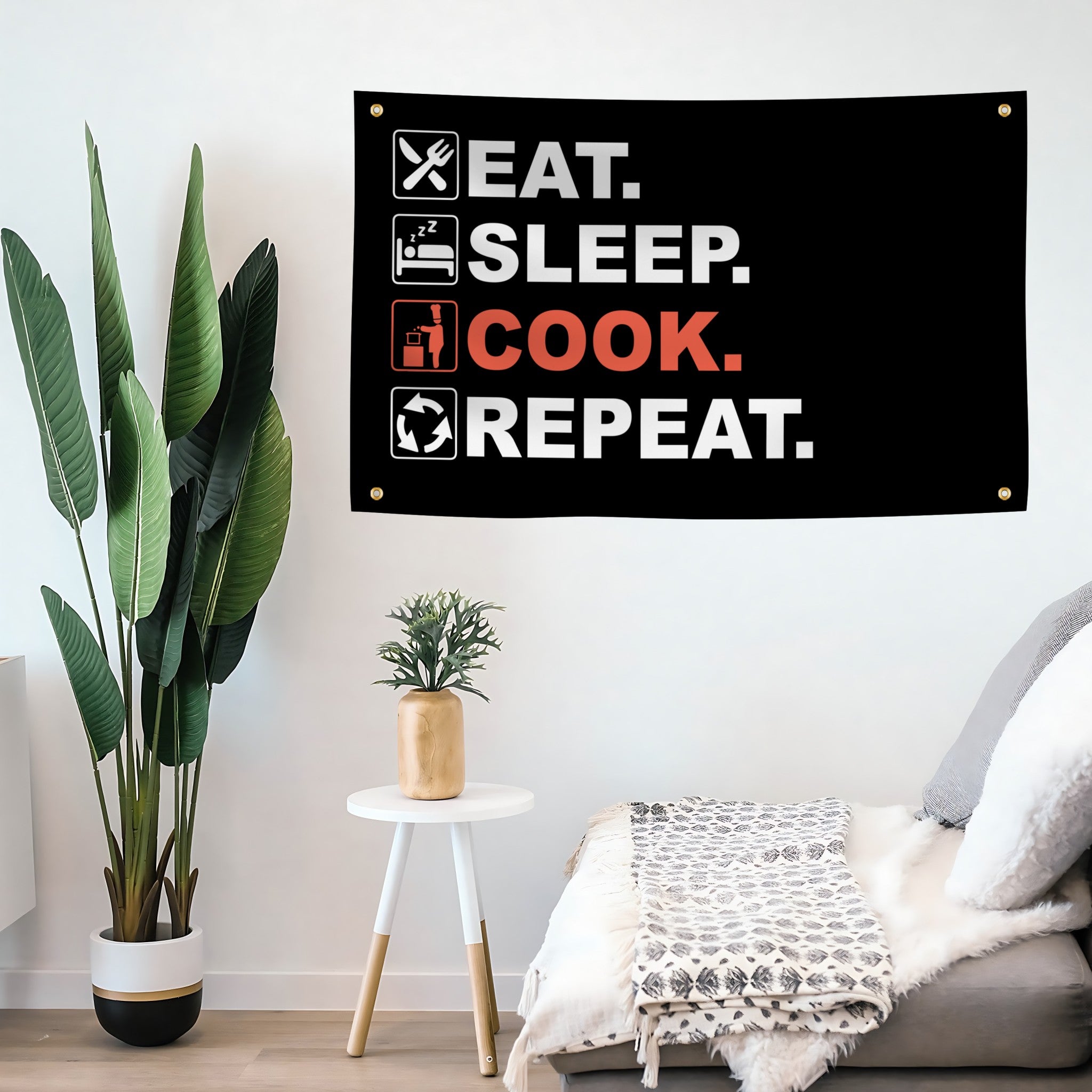 Decorative flag banner with 'Eat. Sleep. COOK. Repeat.' text in a living room setting.