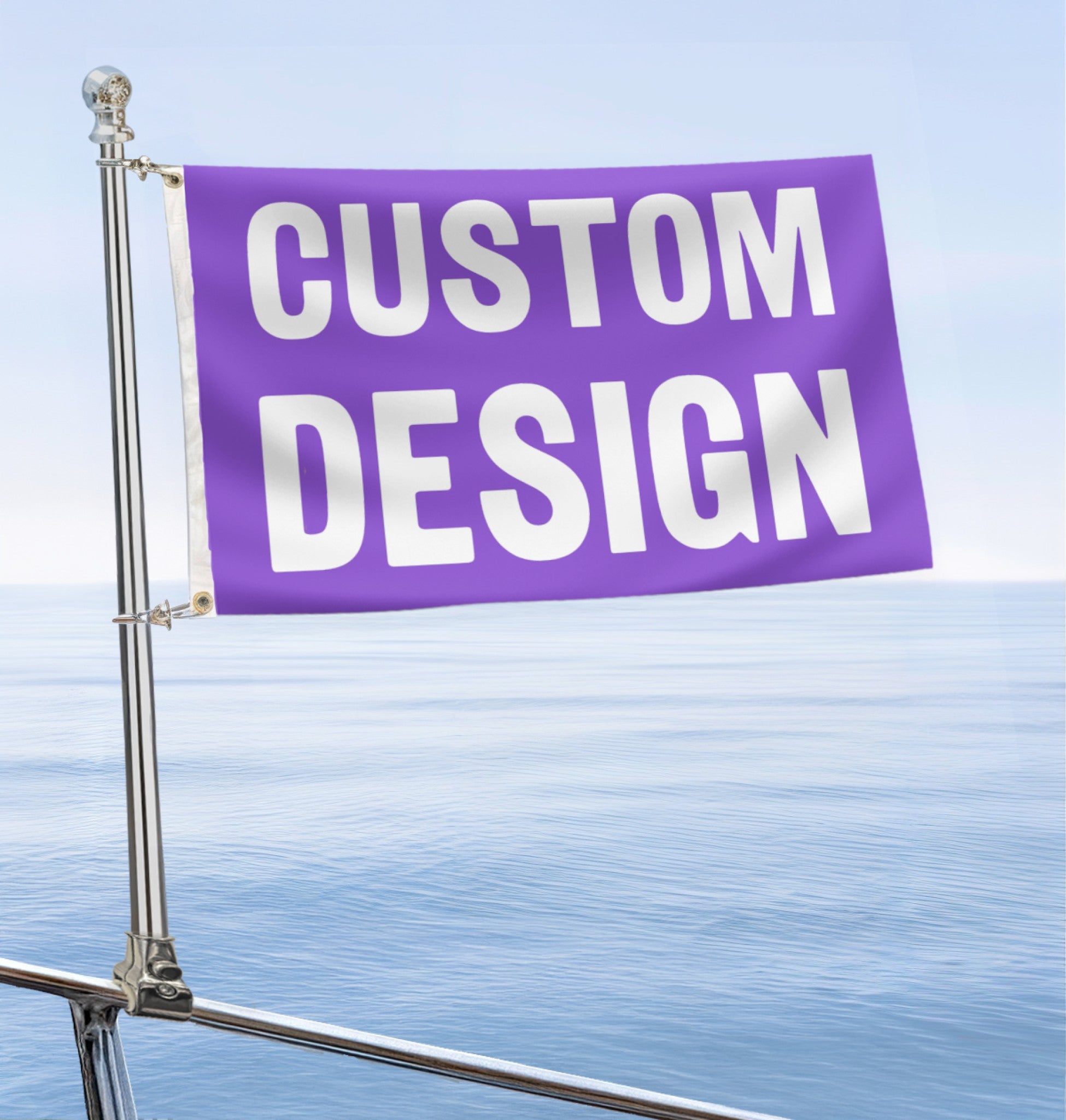 Custom boat flag with 'CUSTOM DESIGN' text on a metal pole attached to a boat railing against a blue sky.