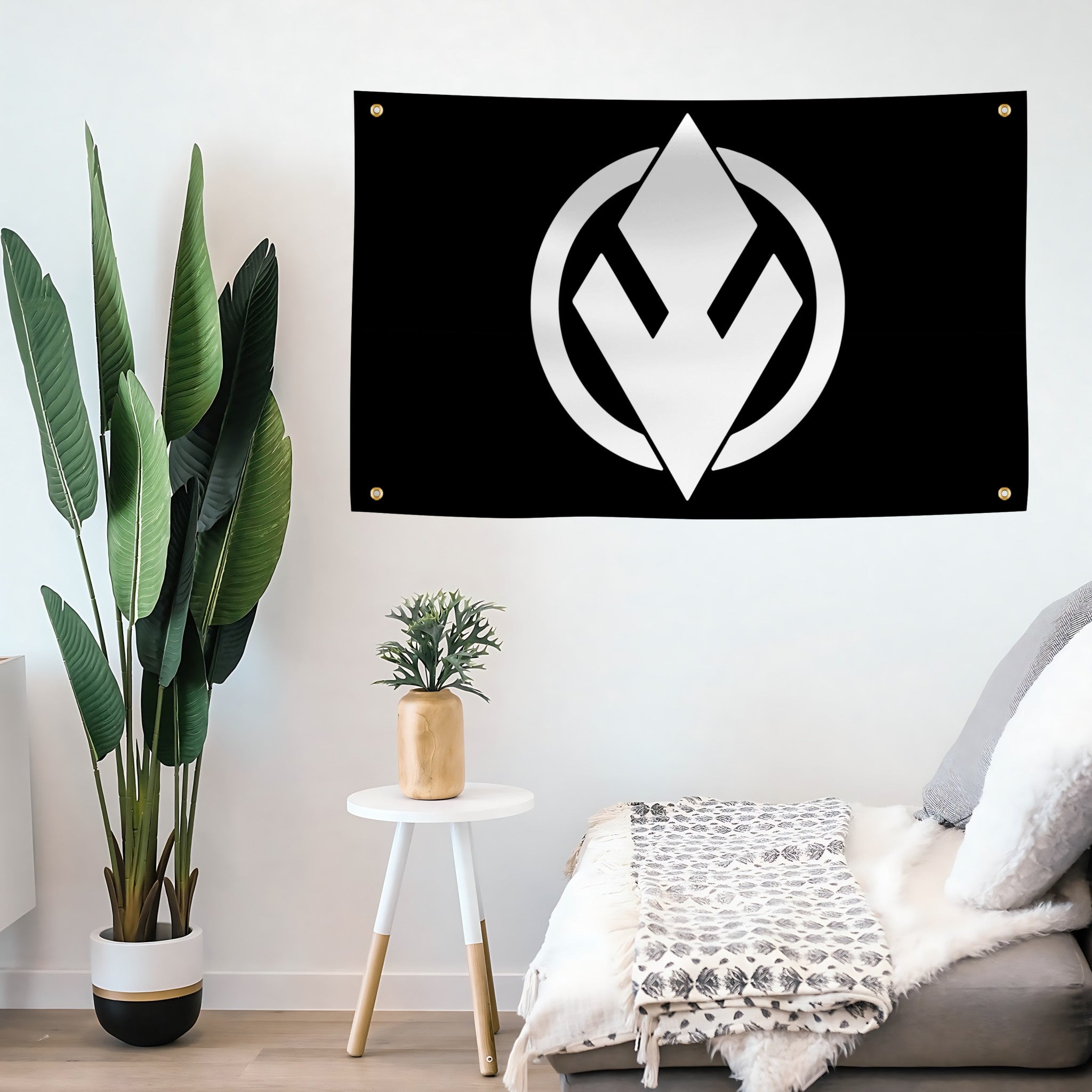 Black banner with a white Star Wars Sith Eternal symbol hanging on a wall above a sofa with decorative plants.