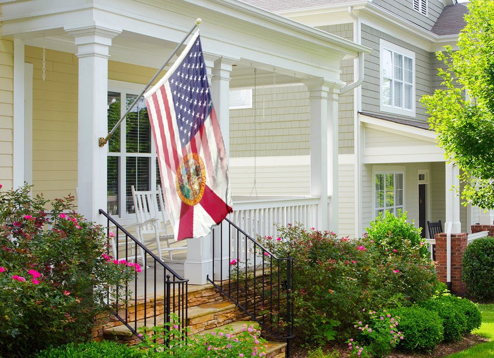 an american flag on a porch of a house