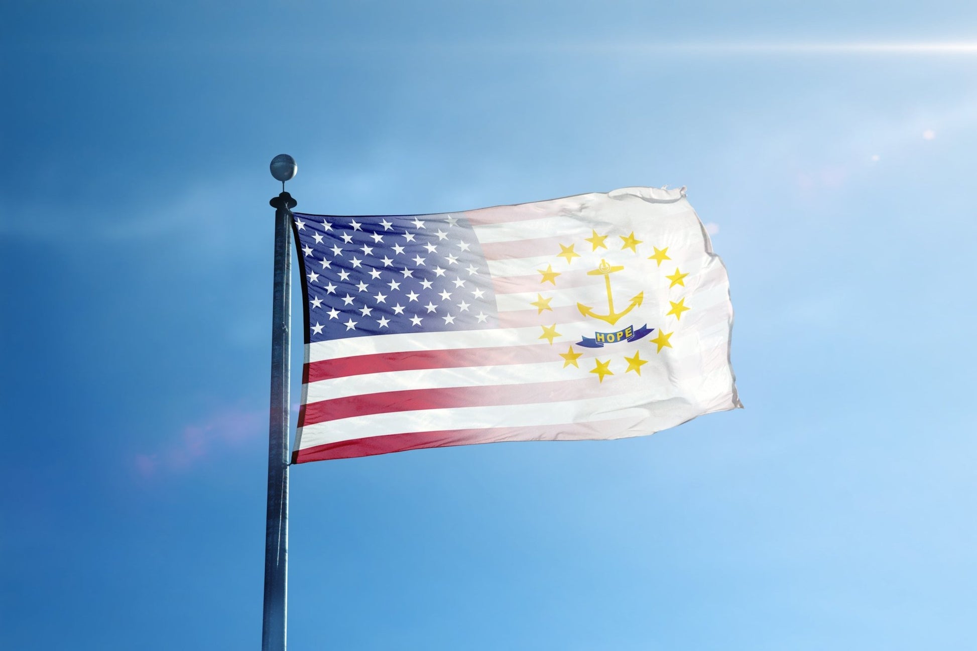 a flag flying in the wind with a blue sky in the background