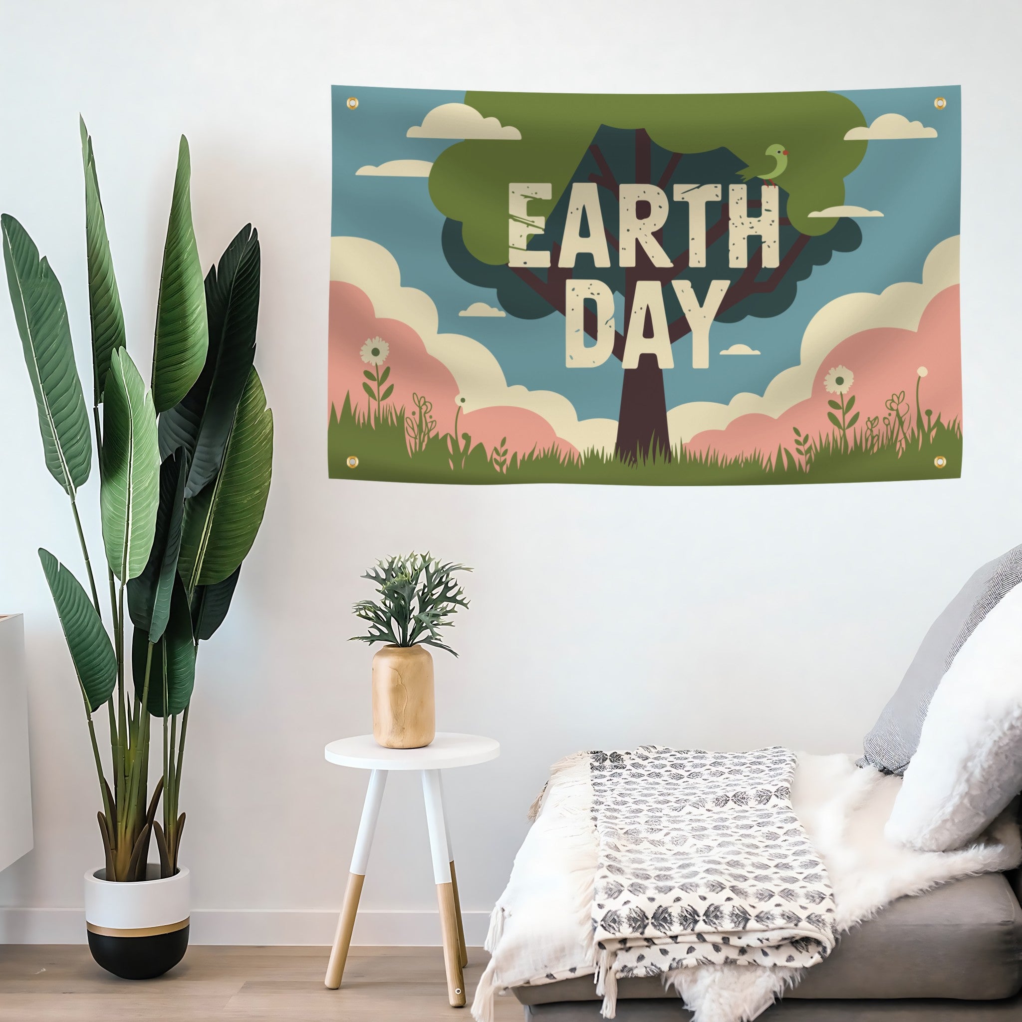 Decorative 'Earth Day' flag banner on a wall with plants and a small table in the foreground.