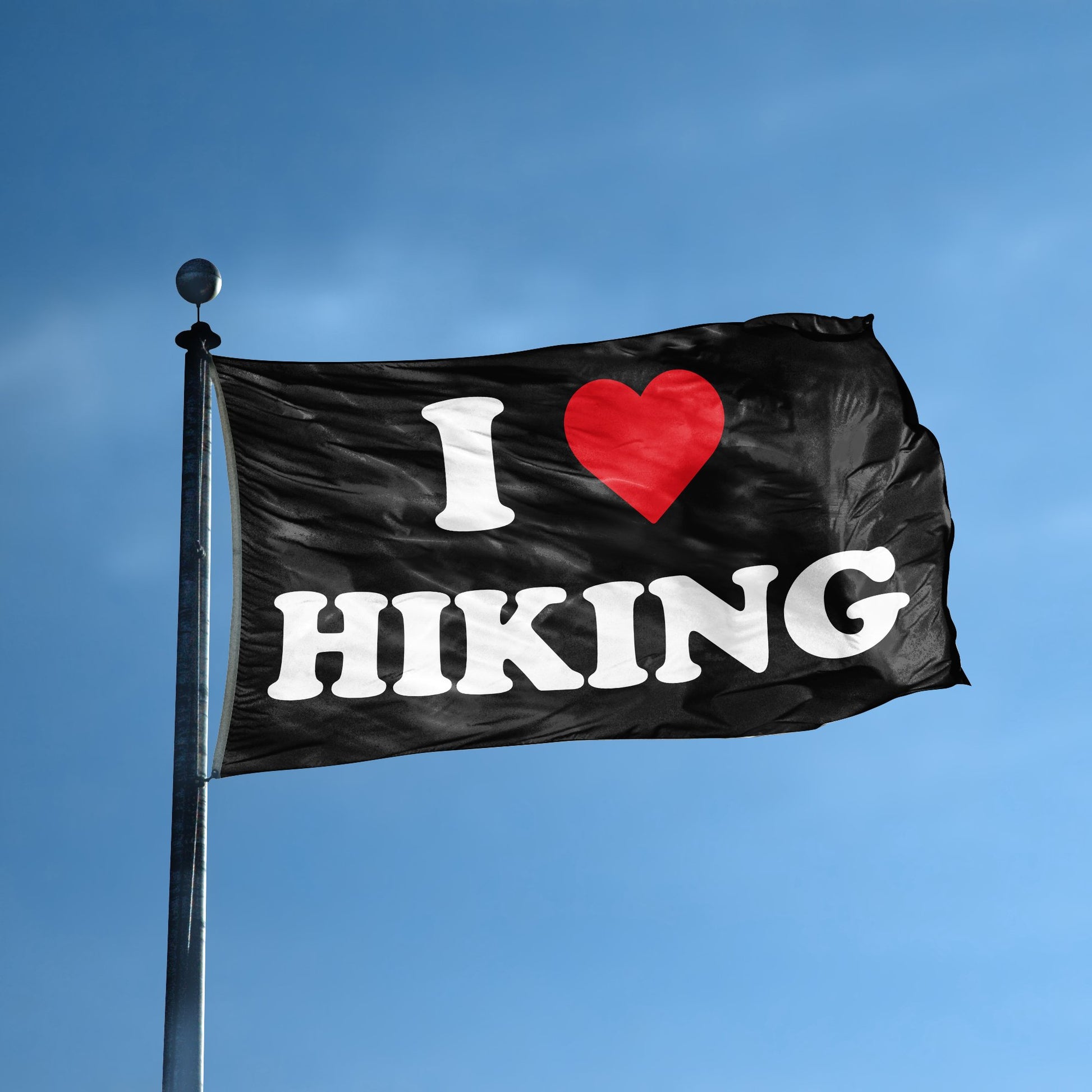 A flag with the saying "I Love Hiking" displayed on a high pole, with a black, white and red color scheme.